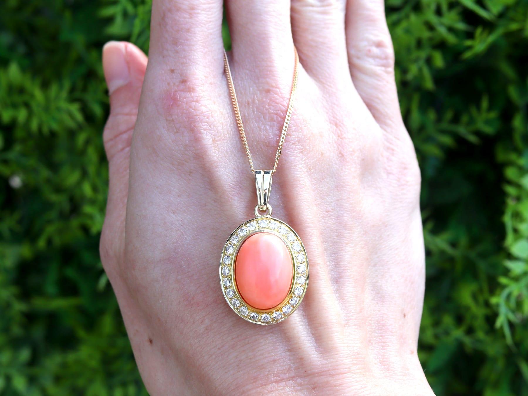 A fine and impressive vintage 9.27 carat coral and 0.80 carat diamond, 18 karat yellow gold pendant; part of our diverse vintage jewellery and estate jewelry collections.

This fine and impressive vintage pendant has been crafted in 18k yellow
