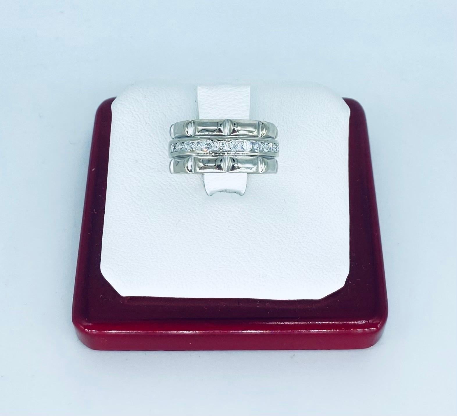 Vintage 9.3mm 0.36 Carat Diamonds Channel Set Bamboo Design 18k White Gold Ring. The ring is 9.3mm wide and is a size 5.25
The ring features very clean and white round diamonds with a bamboo theme. Made in 18k white gold, this ring weights 9.5 grams.