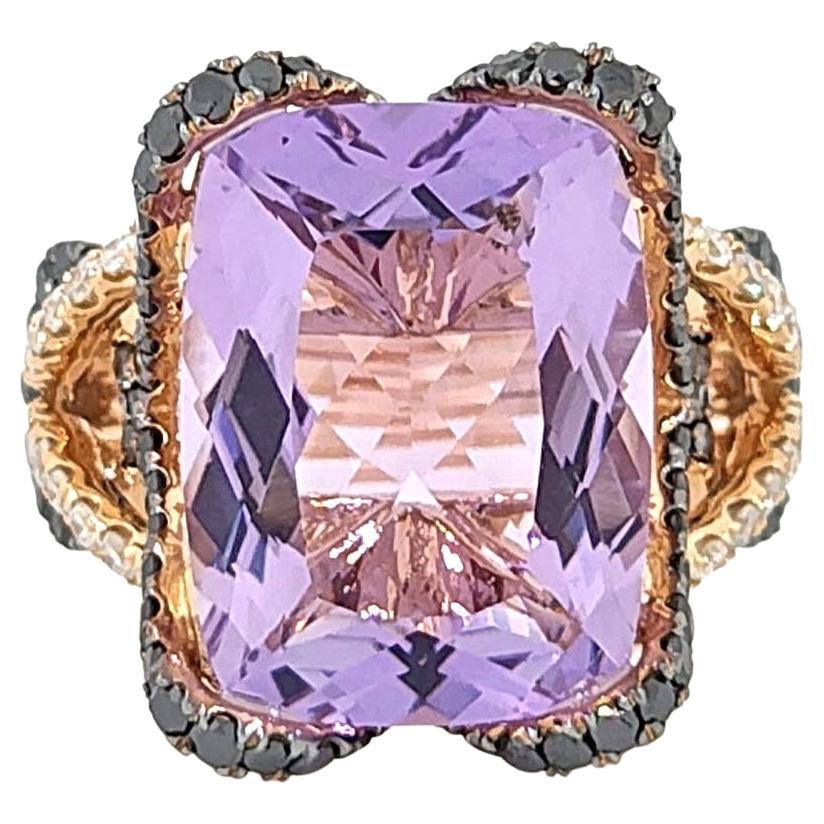 Introducing the exquisite 9.71 Amethyst Ring, adorned with shimmering white brilliant cut diamonds and captivating black diamonds, all nestled in a luxurious 18 Karat Rose Gold setting. This magnificent piece seamlessly combines elegance and allure,
