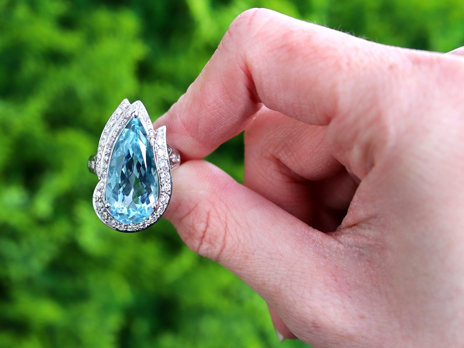 A stunning, fine, and impressive vintage 9.93 carat aquamarine and 0.62 carat diamond, platinum dress ring; part of our diverse vintage jewelry and estate jewelry collections.

This stunning, fine and impressive vintage aquamarine ring has been
