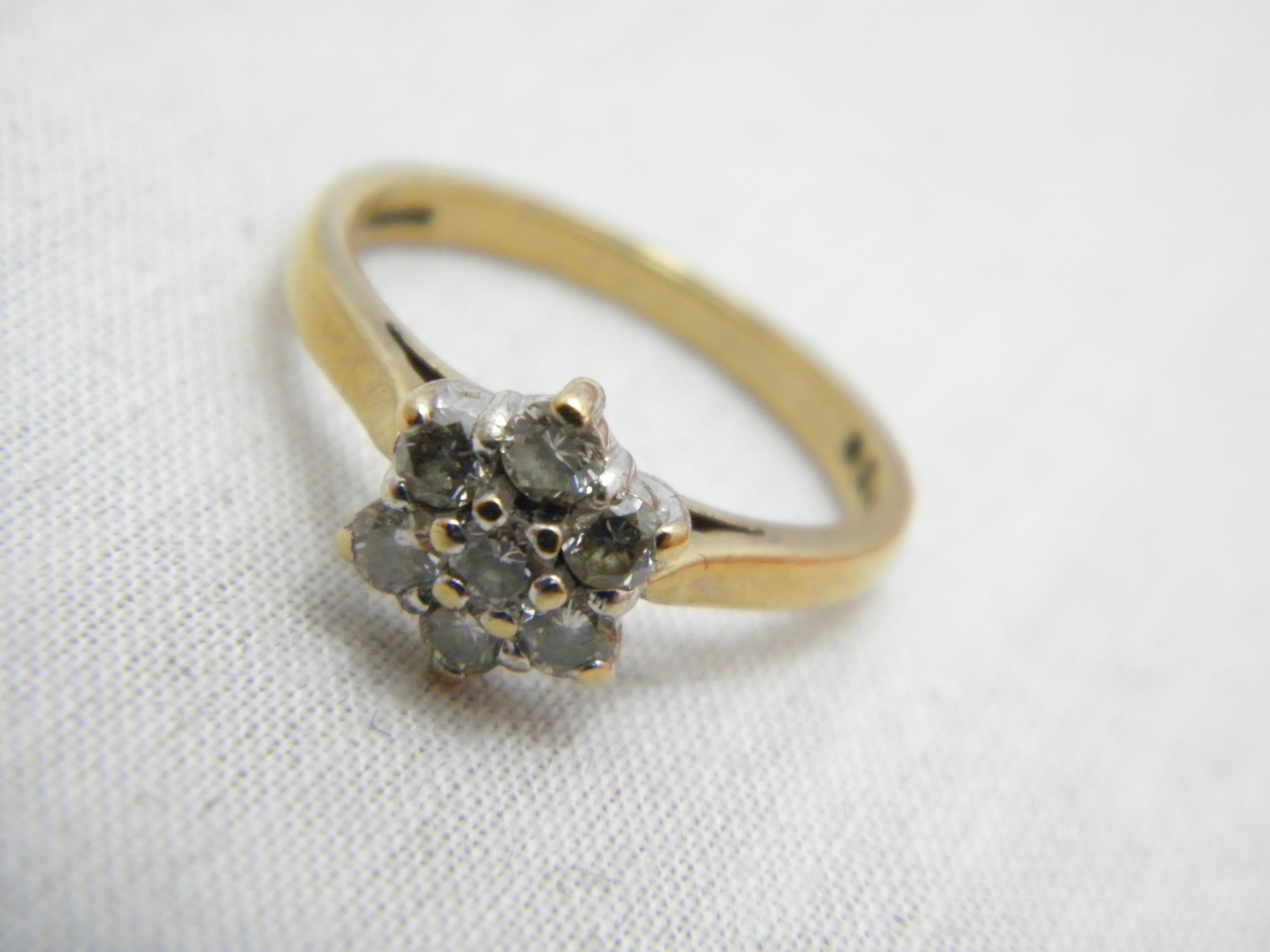 If you have landed on this page then you have an eye for beauty.

DETAILS
Material: 9ct 375/000 Yellow Gold
This ring has a sturdy shank hence ideal if resizing needed
Gemstones: 7 x Round Brilliant cut ice white diamonds in daisy cluster.
All gems
