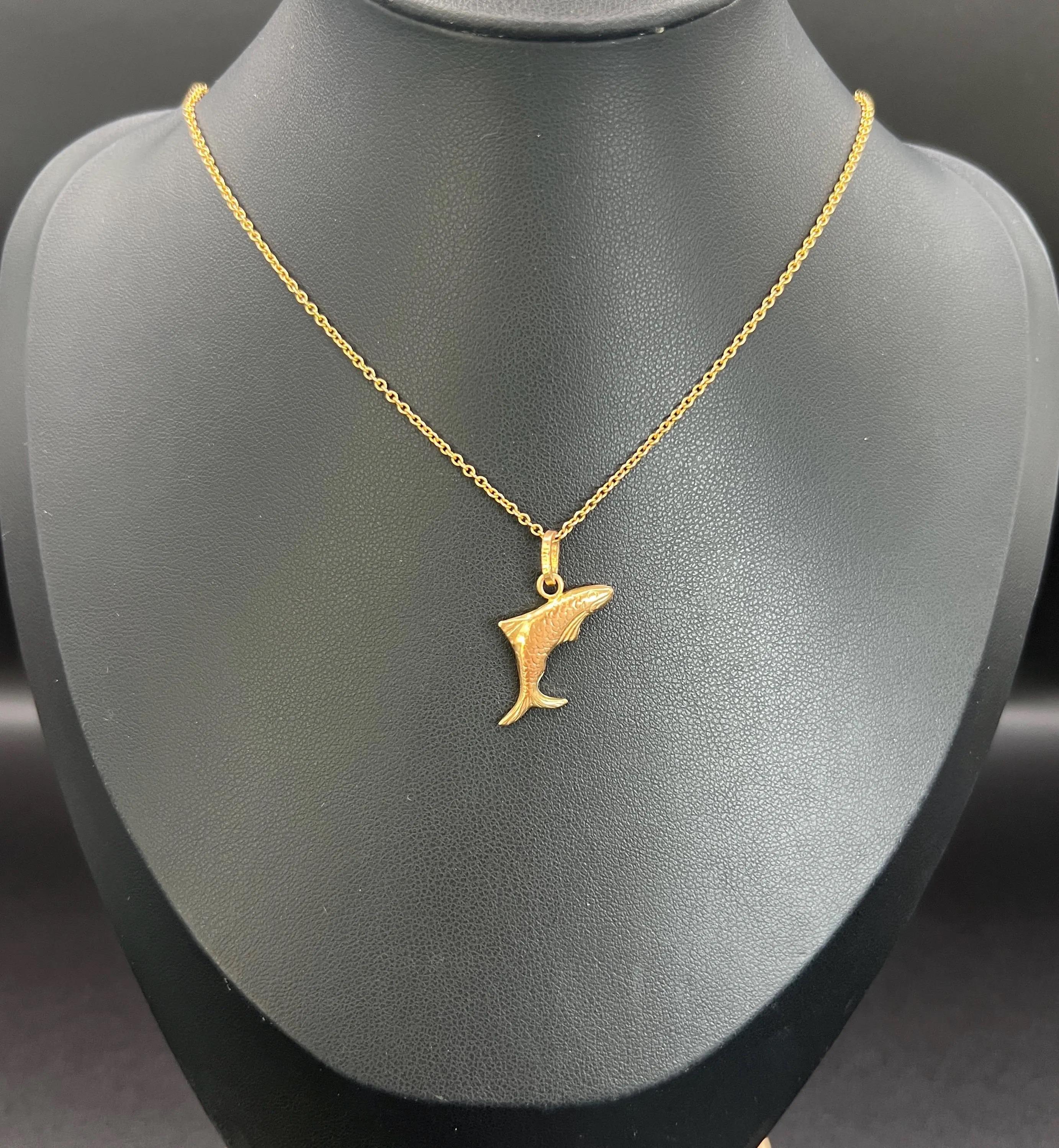 Lucky Fish Pendant

9ct Gold Stamped 375

Hallmarked Italy 

Circa 1990s

Introducing a stunning 9ct yellow gold vintage lucky fish pendant charm featuring an Italy gold hallmark. He would look lovely suspended from one of our vintage gold chains or