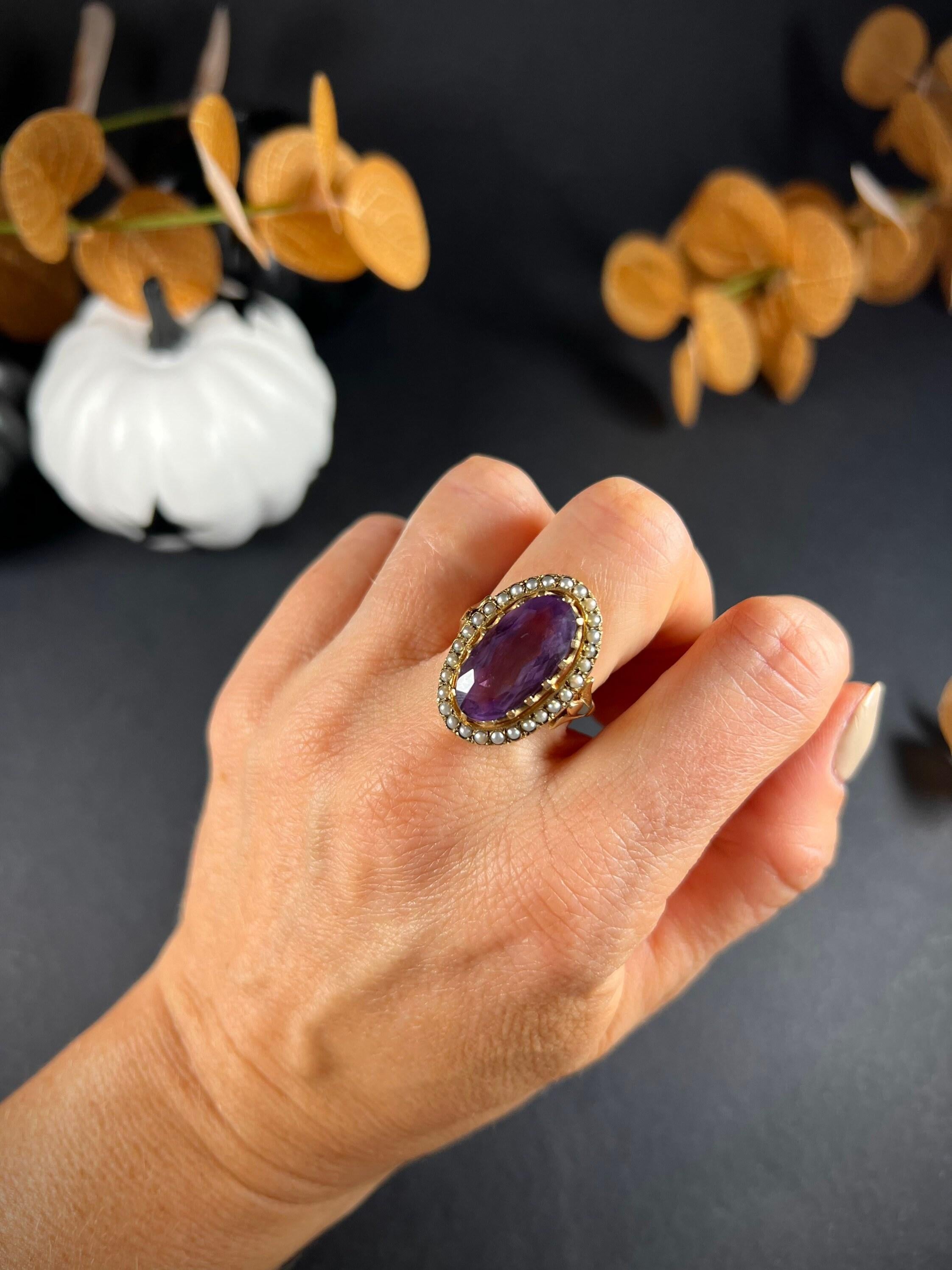 Vintage Amethyst Ring

9ct Gold Stamped

Circa 1940’s

Fabulous sized, vintage cocktail ring. Set with a large, oval, faceted amethyst & a border of beautiful, milky seed pearls. Mounted on a fancy shouldered, yellow gold shank. 

Measures approx