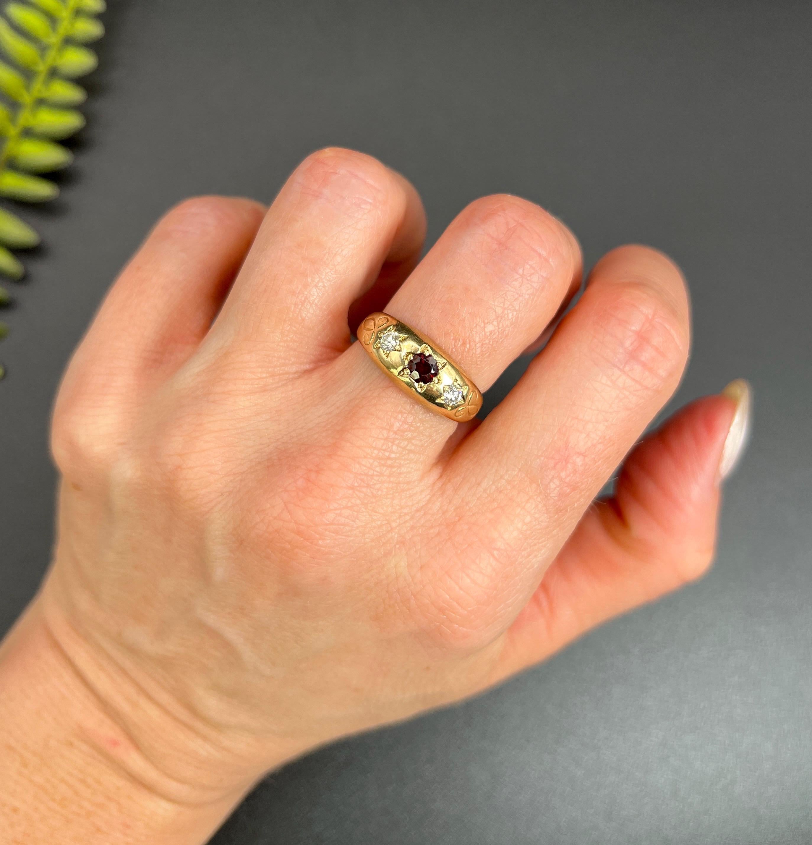 Vintage Ring

9ct Yellow Gold 

Hallmarked Birmingham 1978

Makers Mark W J H  

Introducing a stunning 9ct yellow gold vintage three-stone band. This exquisite ring showcases a central Garnet and two natural diamonds, all beautifully star-set. The