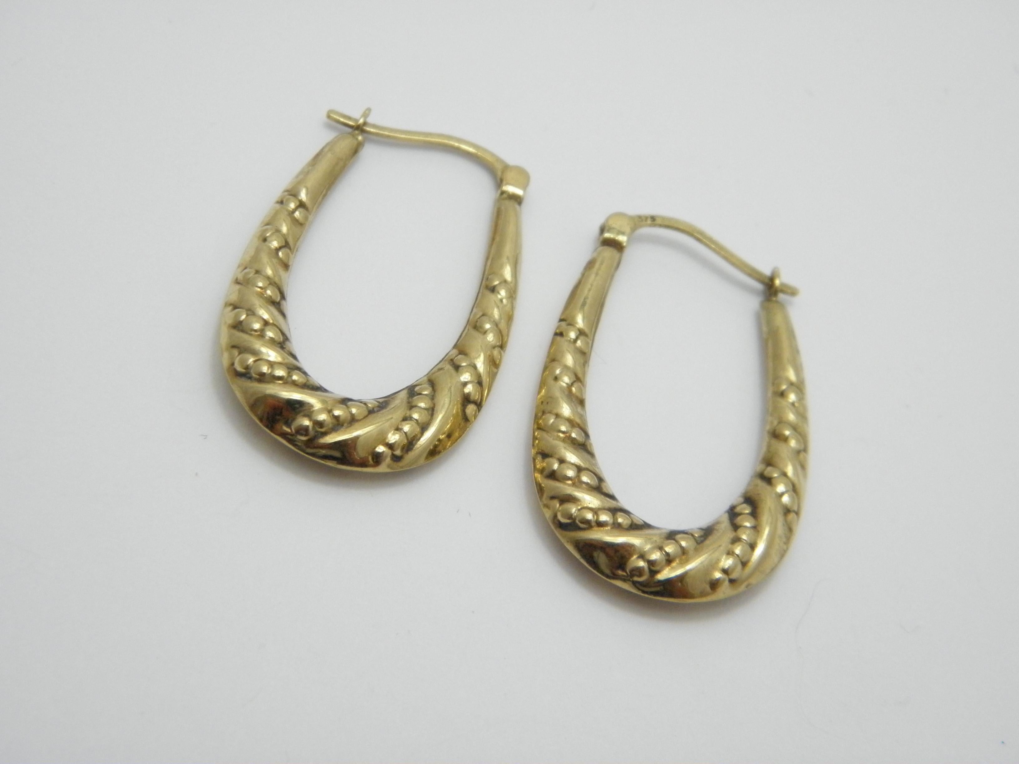A very special item for you to consider:

9CT GOLD PATTERNED LARGE HUGGIE HOOP CREOLE EARRINGS

DETAILS
Material: 375/1000 9ct Solid Yellow Gold
Style: Nouveau style large huggie hoop earrings with lovely bobble patterns.
Fastening: Lever wires,