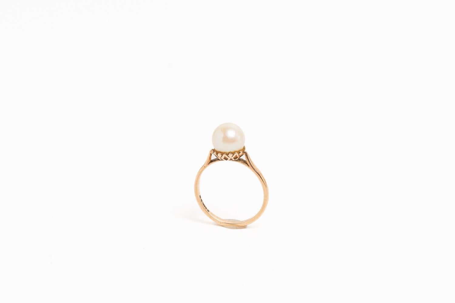 This gorgeous and timeless pearl vintage ring set in 9ct yellow gold is hallmarked for London 1966. Delicate and soft cream pearl is standing out and it would be a great addition for someone who loves elegancy and timeless design. Fully hallmarked