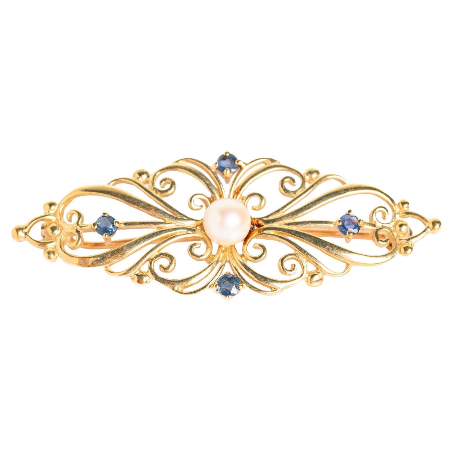Broche vintage de oro de 9 ct con perlas y zafiros
