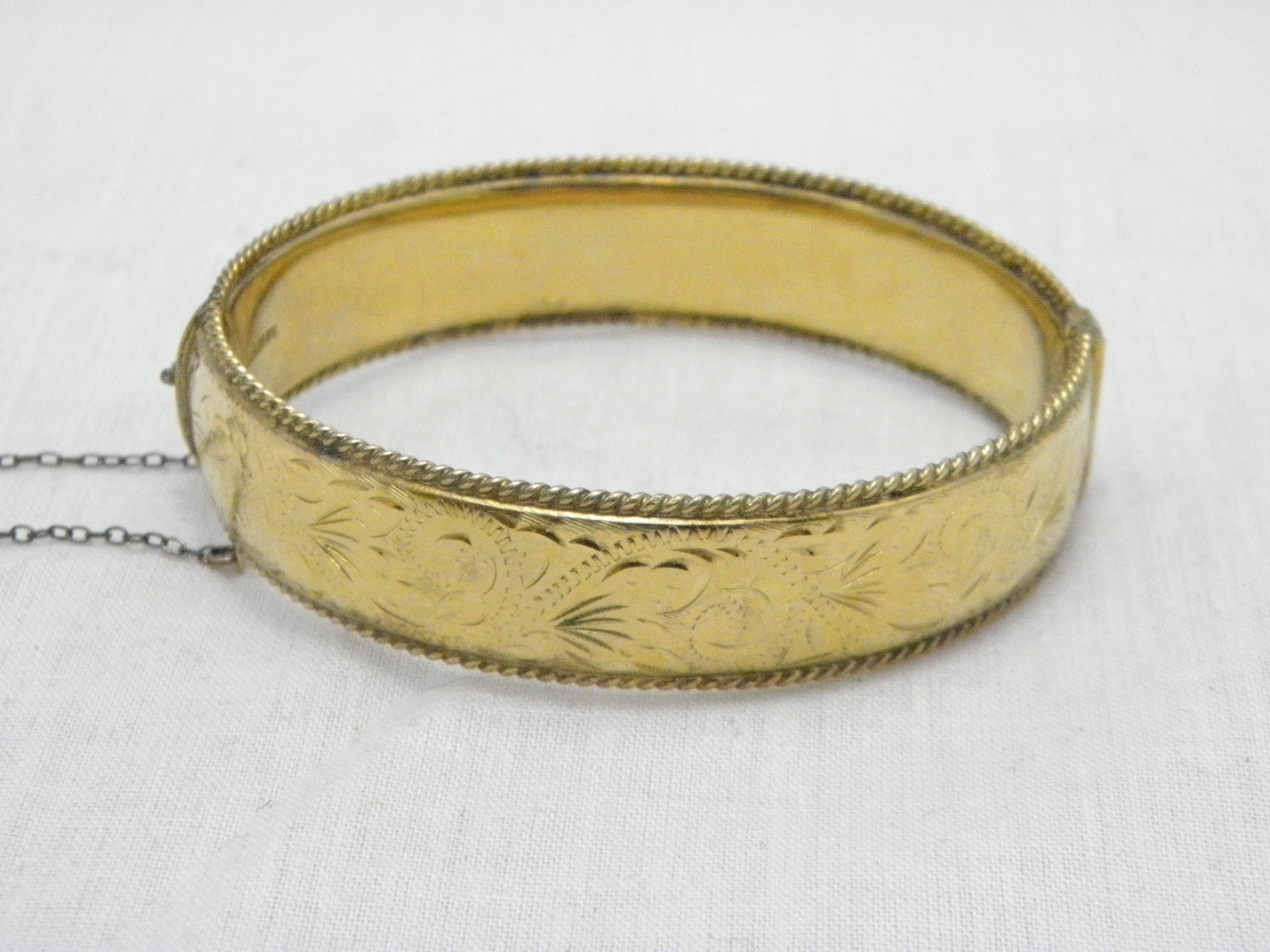 If you have landed on this page then you have an eye for beauty.

On offer is this gorgeous
9CT GOLD ROLLED FLORAL ENGRAVED HINGED BANGLE BRACELET

DETAILS
Material: Thick 9ct Rolled Gold (see details below)
Style: Hinged Cuff with Hand Engraved