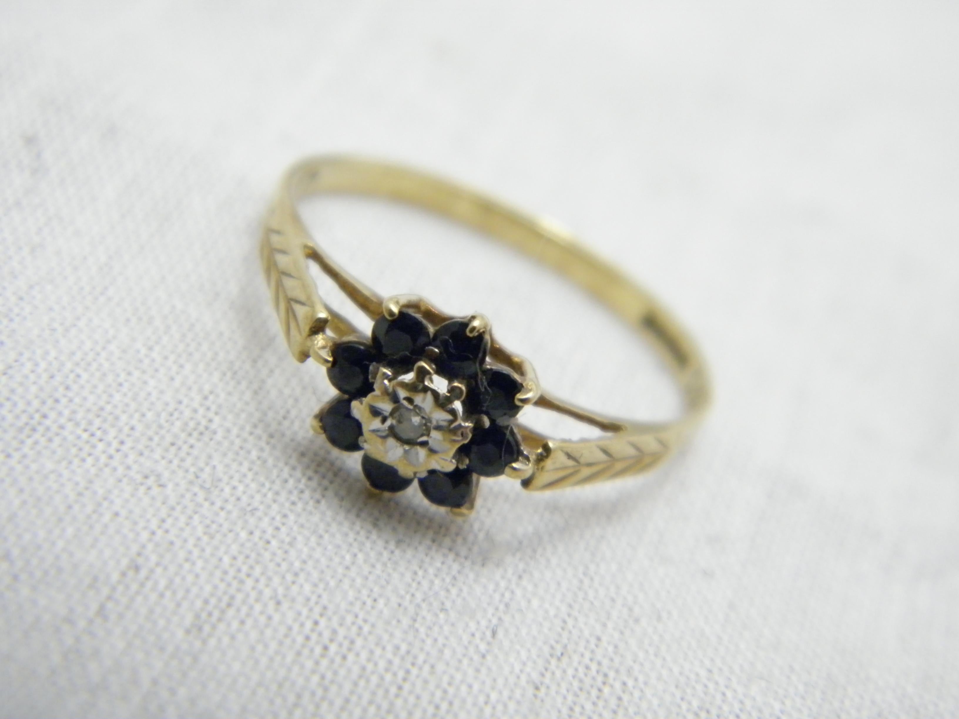 If you have landed on this page then you have an eye for beauty.

On offer is this gorgeous

9CT GOLD SAPPHIRE AND DIAMOND CLUSTER ENGAGEMENT RING

DETAILS
Material: 9ct 375/000 Yellow Gold
Style: Art Deco style daisy cluster gemstone