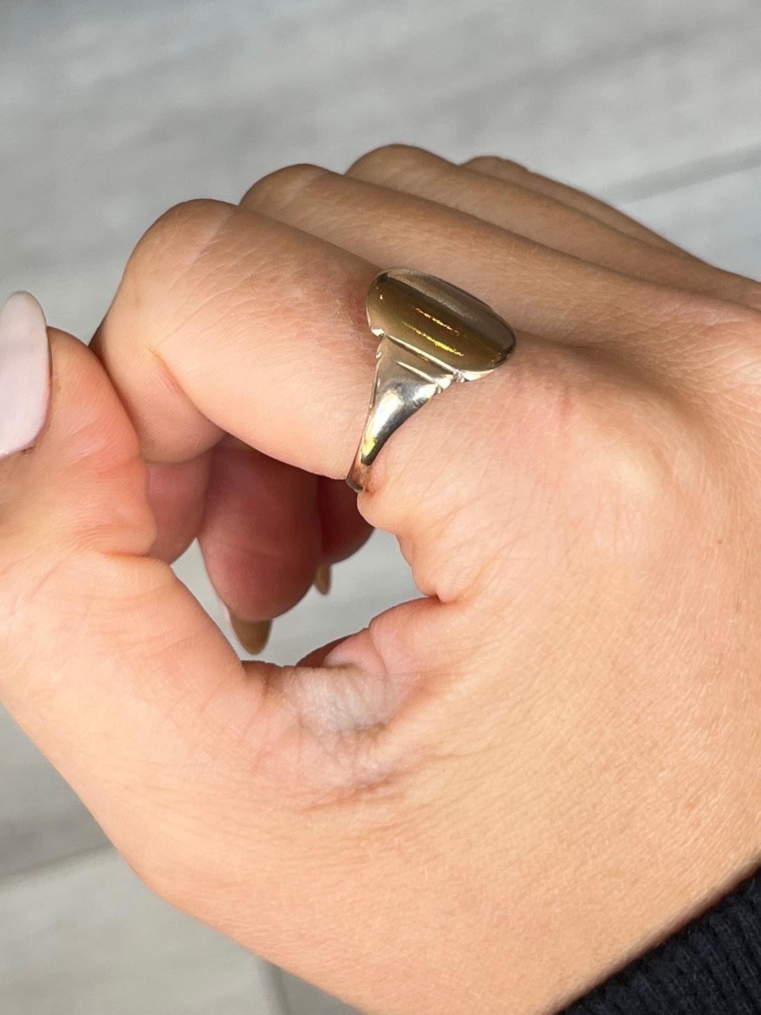 This signet ring has a plain face which could be engraved or kept clean. Modelled in 9carat gold. 

Ring Size: S or 9 1/4 
Face Dimensions: 14x10mm

Weight: 2.5g

