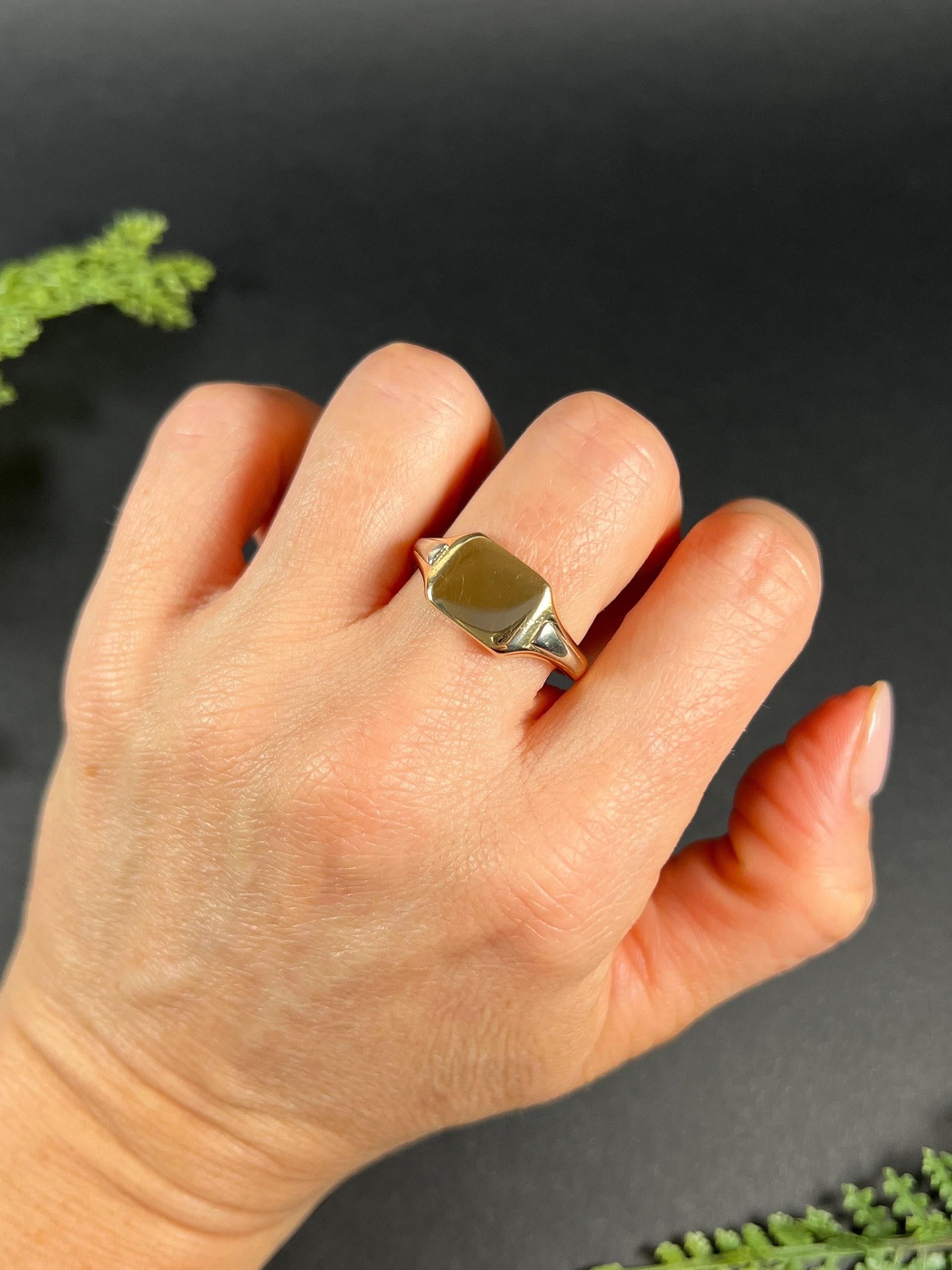 Antique Signet Ring 

9ct Gold Stamped

Hallmarked Birmingham 1933

Makers Mark A C Co- The Albion Chain Company

This 9ct gold signet ring is a true masterpiece. Its rectangular plain gold design gives it a classic look while the lovely white gold