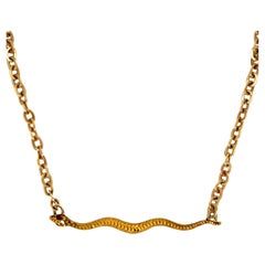 Collana a serpente in oro giallo 9K/14K vintage con rubini e diamanti.