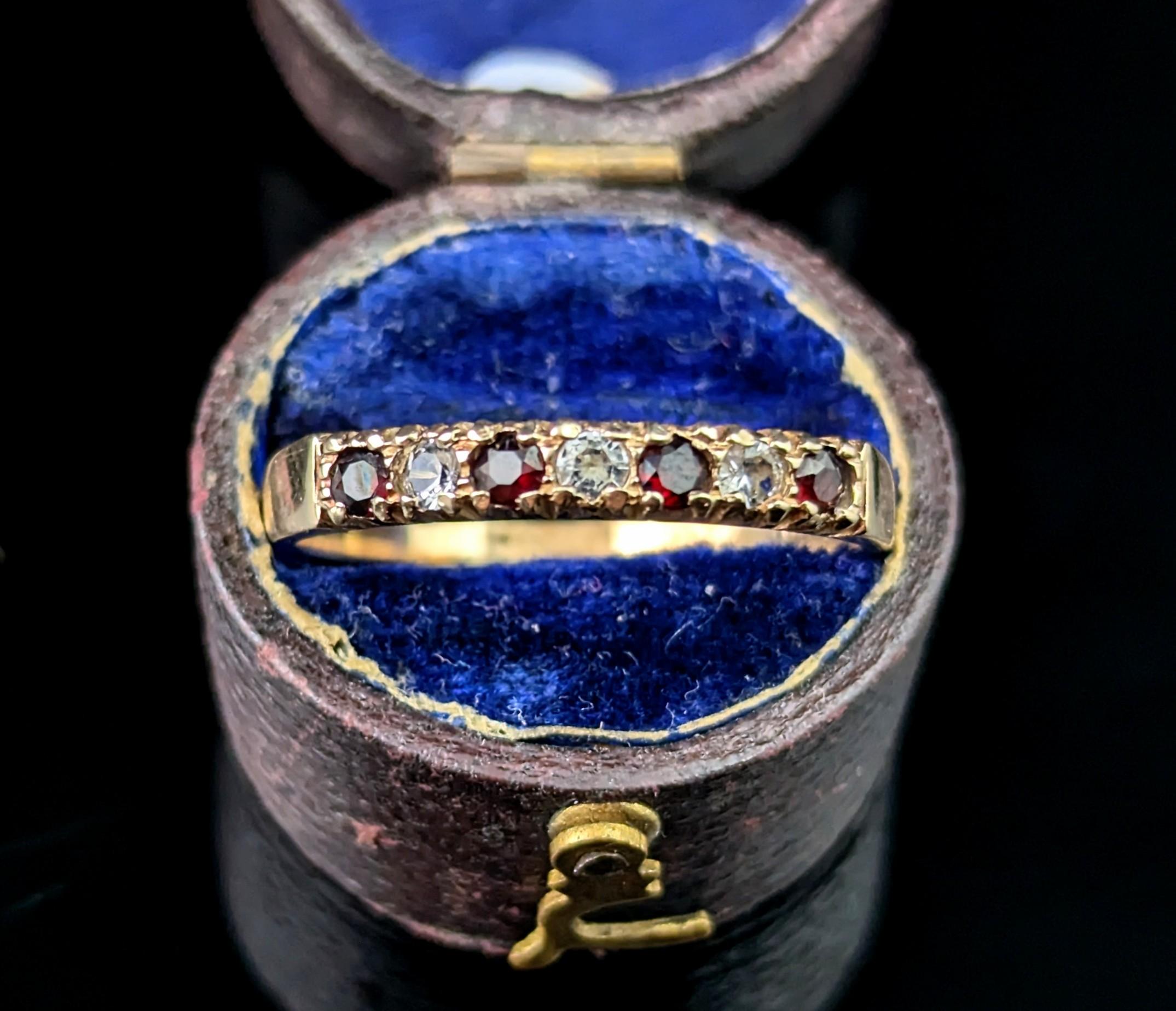 A sweet vintage 9ct gold Garnet and Paste half hoop ring.

It is a half eternity style band perfect for stacking with other rings or wearing alone.

In rich 9ct yellow gold it is has a slightly tapering band and is fully hallmarked.

Marks and