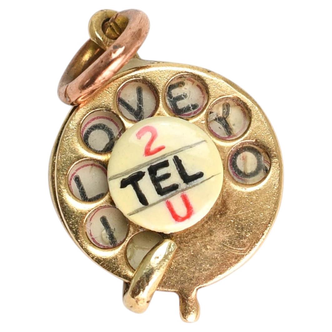 Amuleto de teléfono vintage de oro de 9 quilates "Te quiero", circa 1963