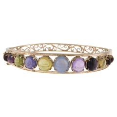 Pulsera brazalete vintage de oro de 9 quilates con múltiples piedras de colores y zafiro estrellado calado