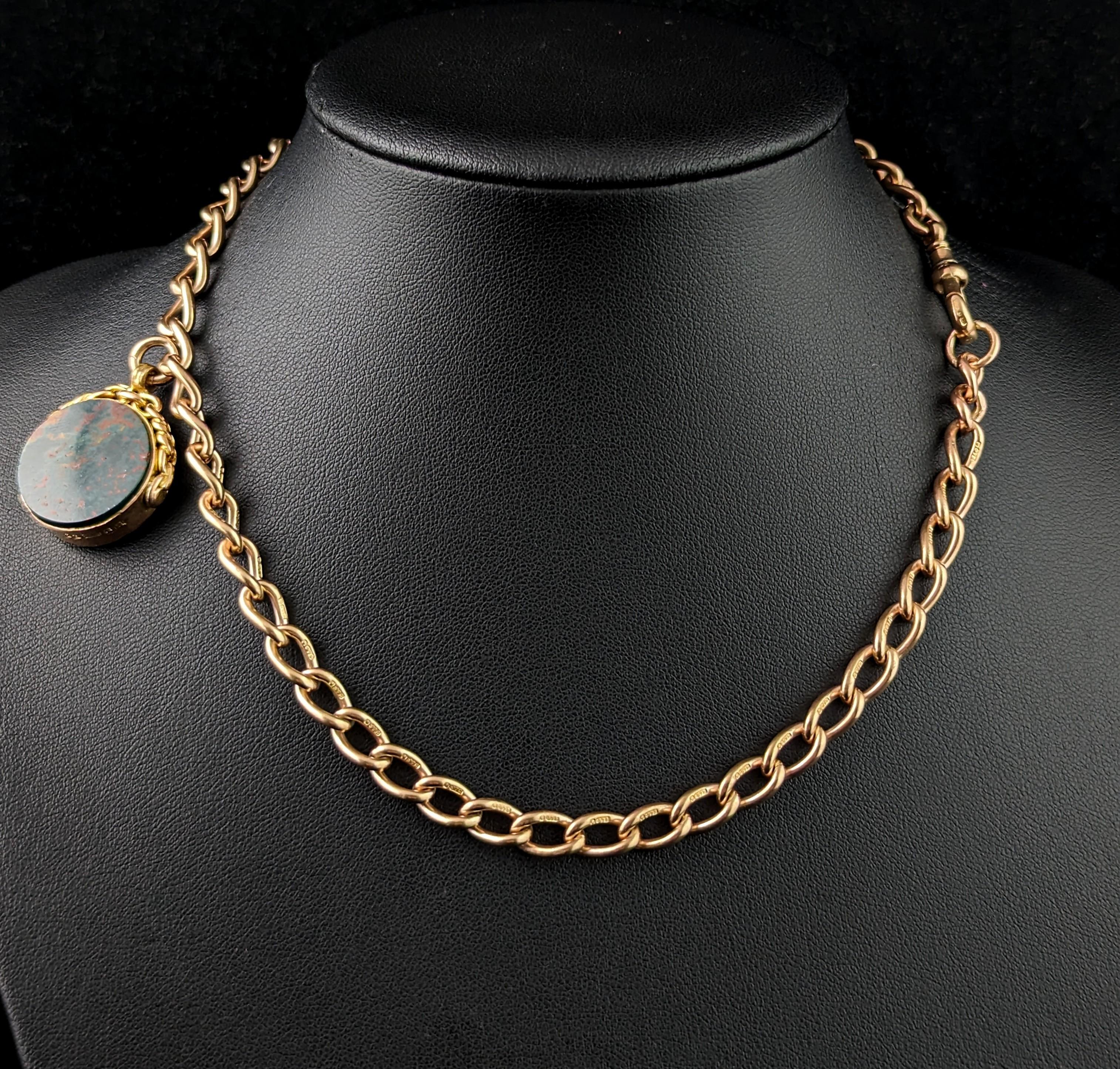 You are sure to be charmed by this handsome vintage Art Deco era 9ct gold Albert chain.

It is an open curb link chain in rich 9ct gold with both rosey and yellow gold tones but a mostly yellow gold hue, each link individually stamped for 9ct gold,