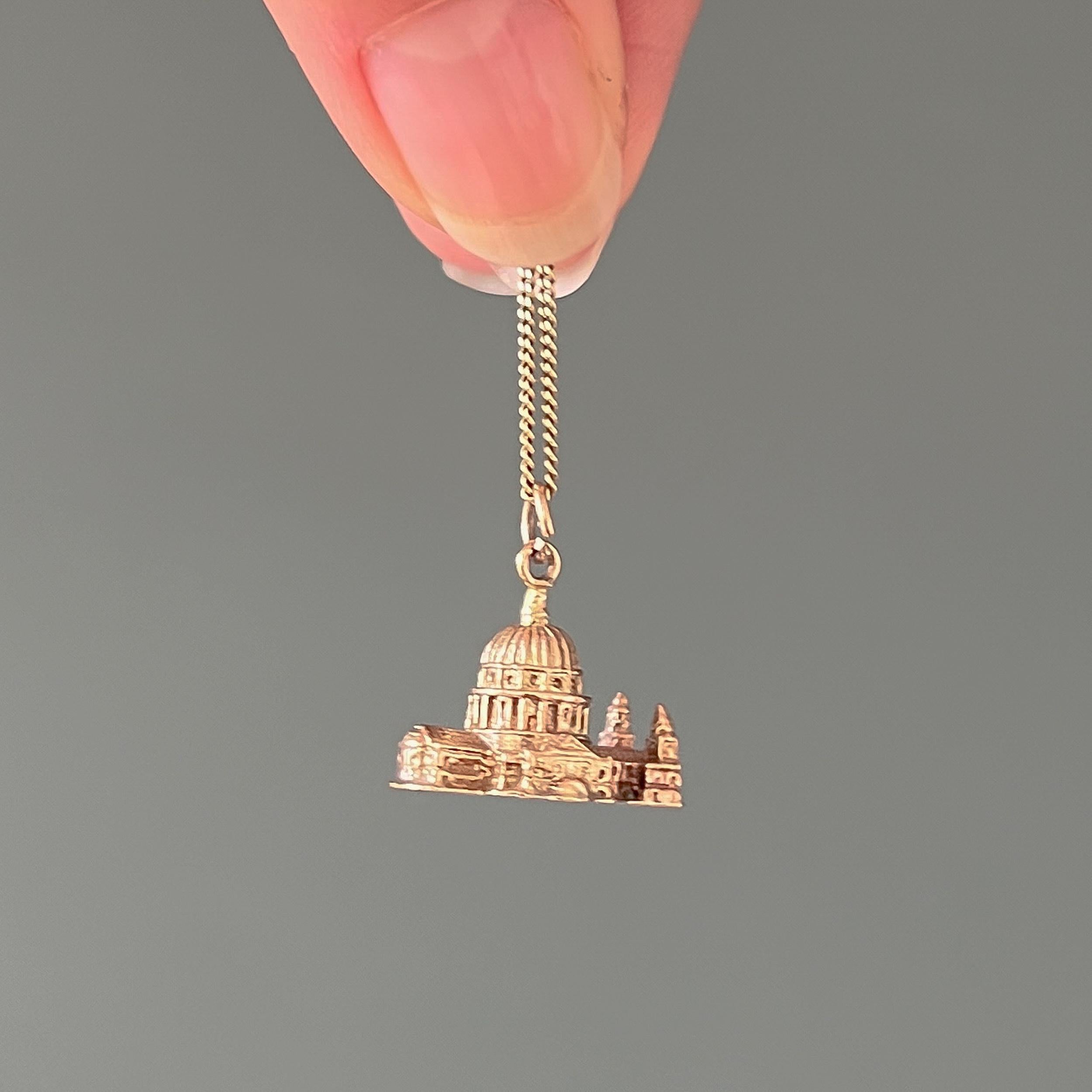 This is a vintage 9 karat yellow gold St. Paul's Cathedral charm pendant. This charm is very detailed and beautifully made. The miniature replica of the famous St. Paul's Cathedral has refined details include small windows and the cathedral's iconic