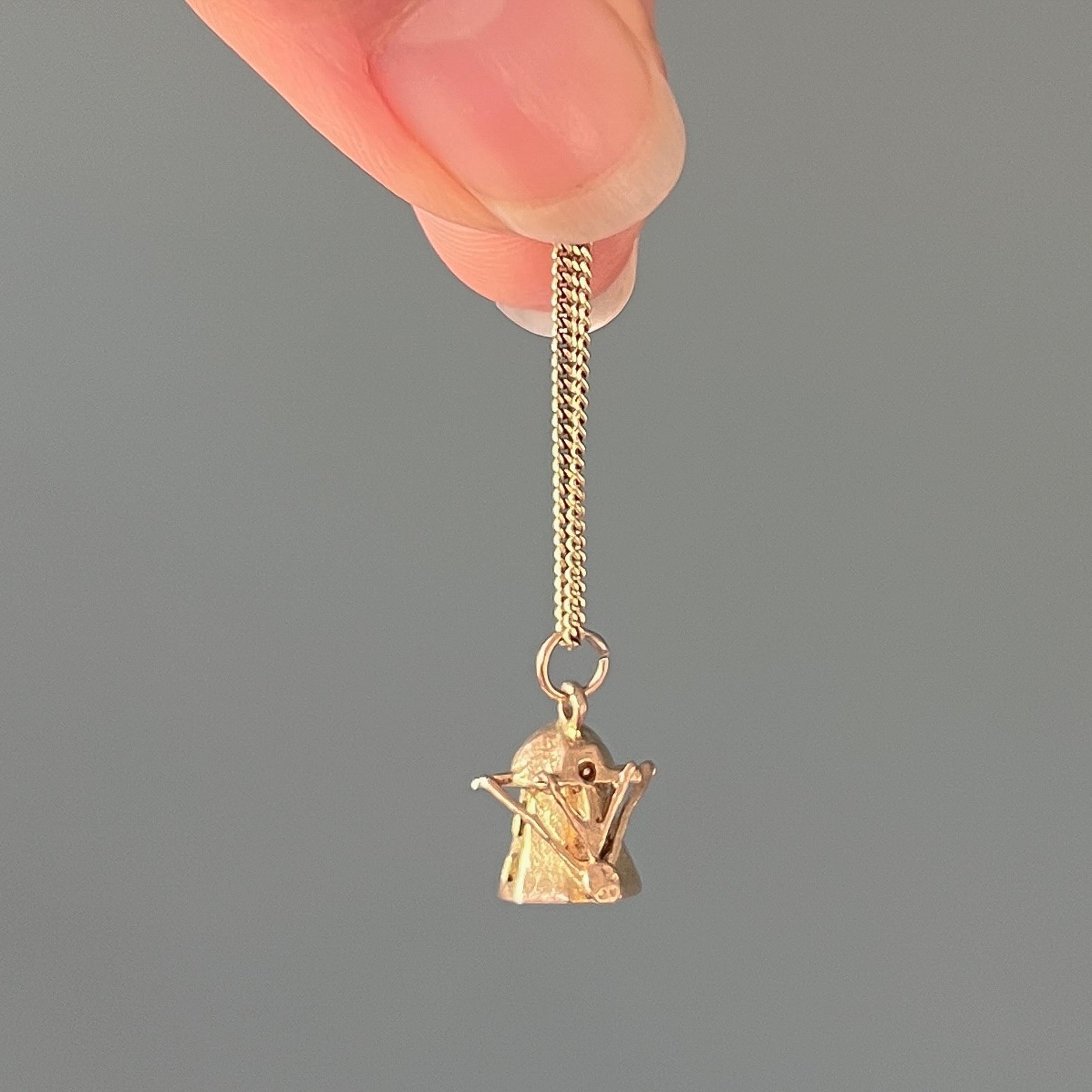 A vintage 9 karat yellow gold small windmill charm pendant. This charm is nicely detailed and beautifully made in gold and it features open windows and an entrance door. The blades of the mill seem to have blown away by the gusts of the wind, which