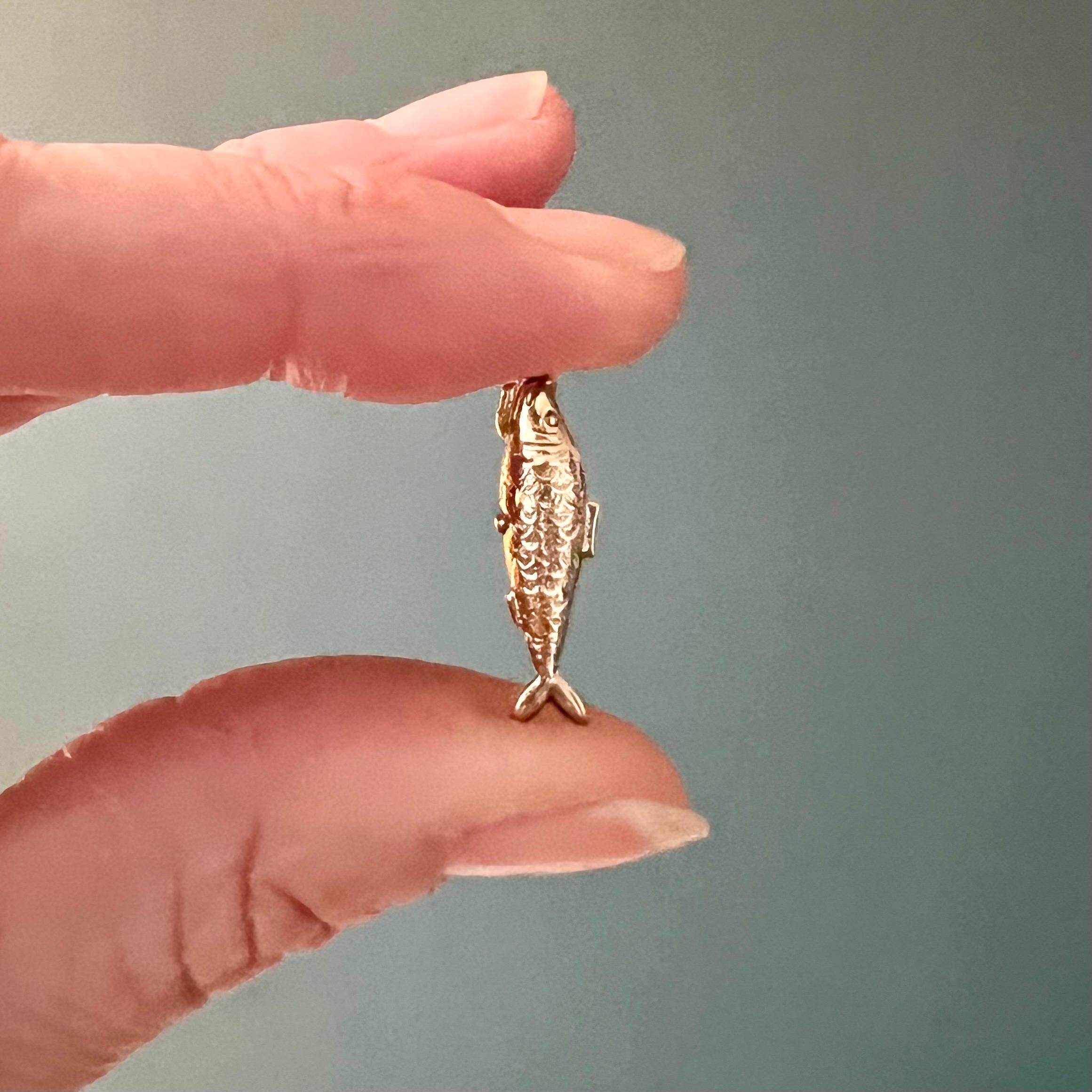 This is a 9 karat gold vintage fish charm pendant. The fish charm is beautifully detailed and has nice engravings with scales and fins on the body.

Charms are great to collect as wearable memories, it has a symbolic and often a sentimental value.