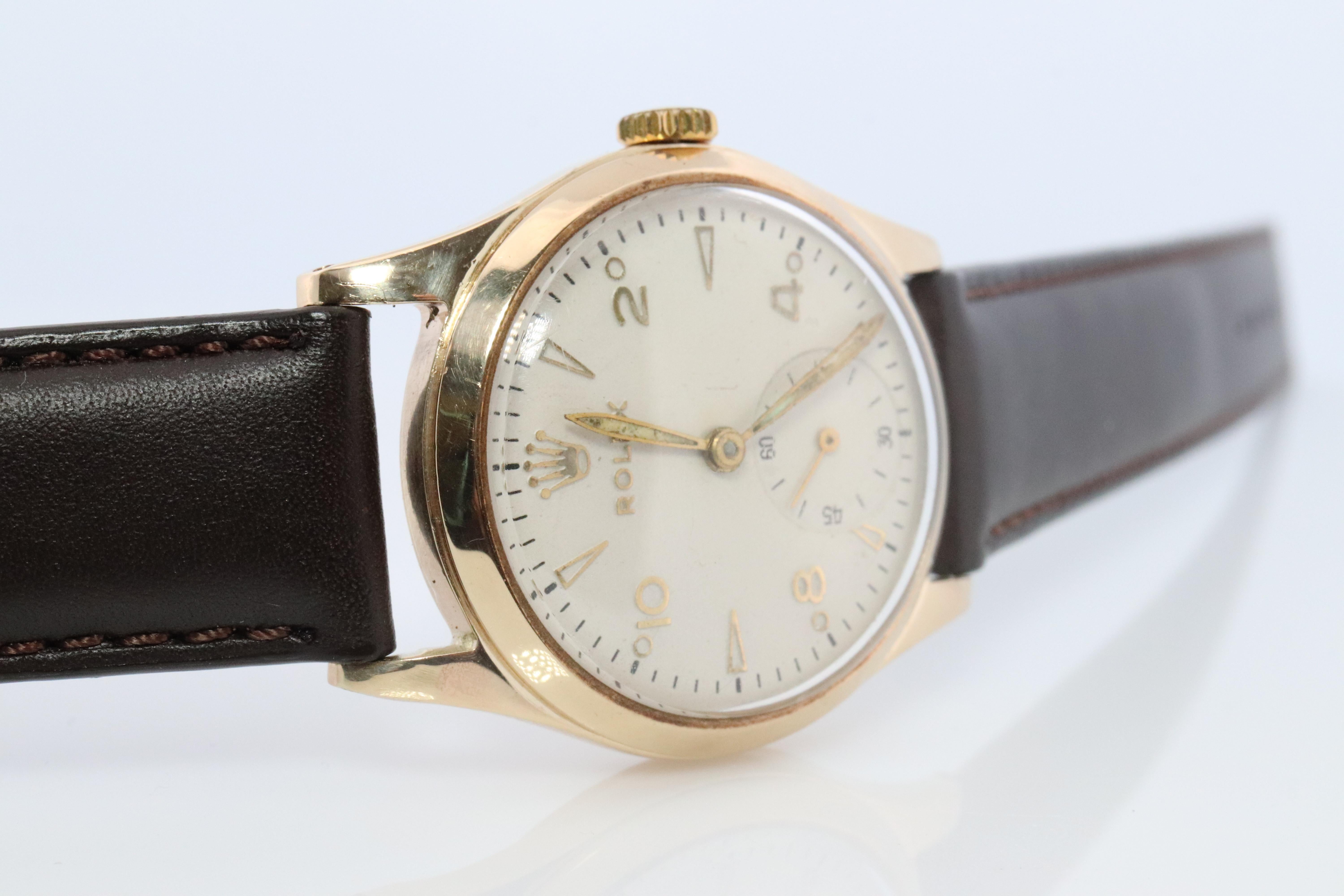Vintage Rolex Mens Watch

9k Yellow Gold Case

ref.12324

Windup Movement. Runs well.
Circa 1946


Beautiful Watch.

New Genuine Gucci Leather band.

30mm round Case