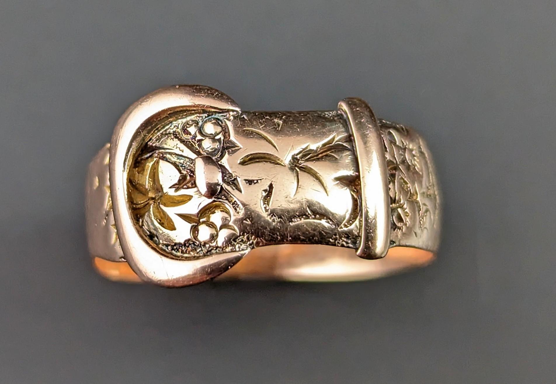 You can't help but be charmed by these old gold buckle rings.

This Art Deco era 9kt Rose gold, engraved buckle ring lends it's style from the Victorian era, the buckle ring really catapulted into popularity at that time and remained a popular