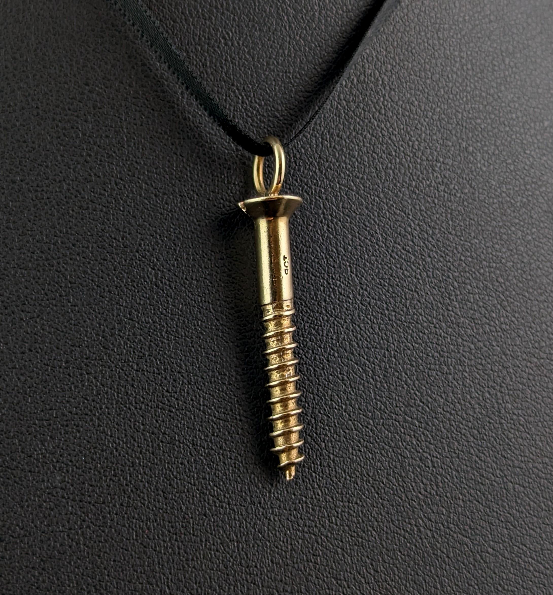 This fabulous novelty vintage 9ct gold screw pendant is truly a fantastic piece.

Small yet mighty, it is made from solid 9ct gold and is realistically modelled as a screw with an integral bale to the top.

So interesting and versatile this pendant