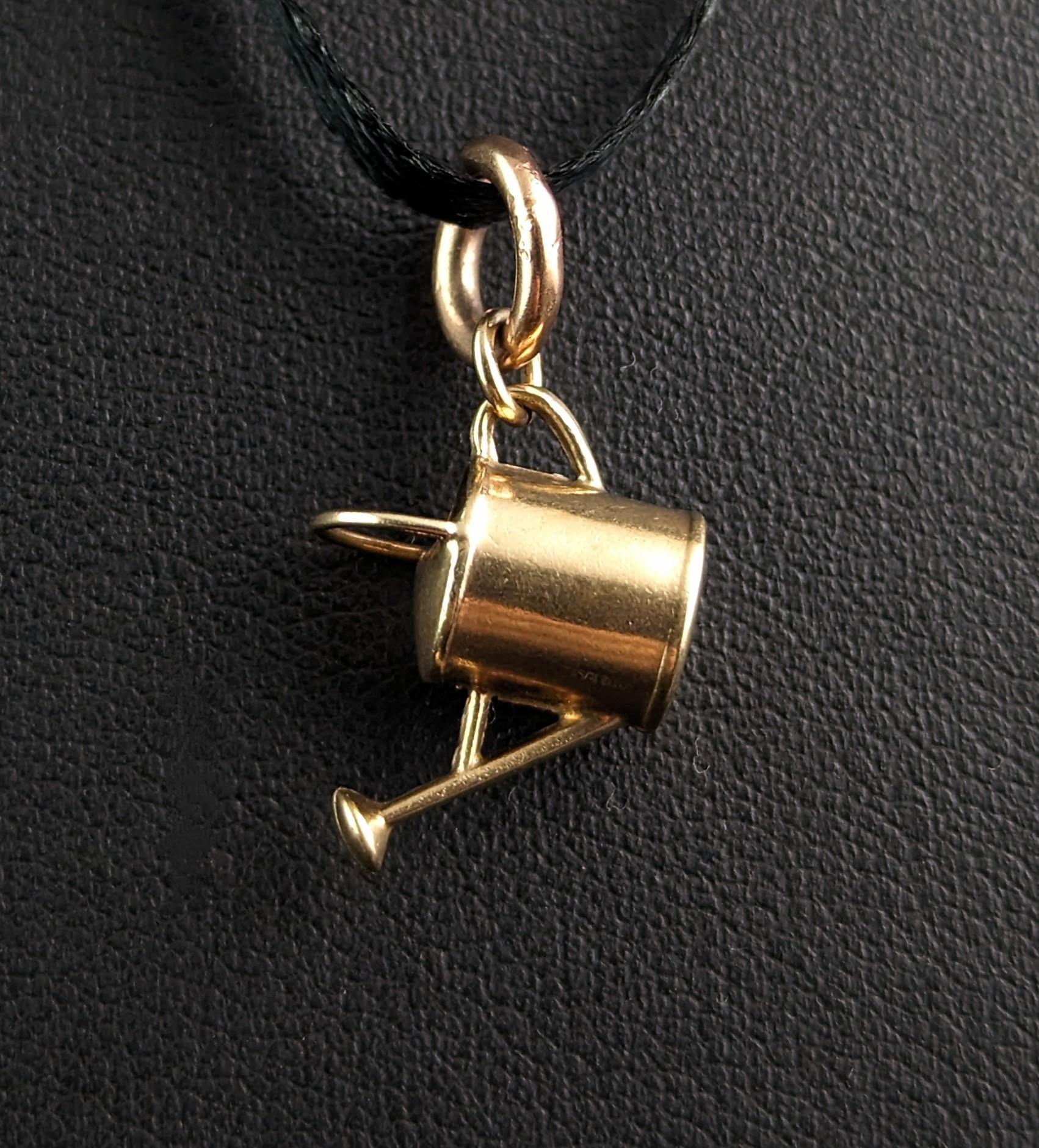 This little novelty vintage 9ct gold charm or pendant is really fun and sweet!

It is finely modelled in rich 9ct yellow gold as a little watering can, the perfect gift for the avid gardener or green fingered friend.

The charm is a mid-century