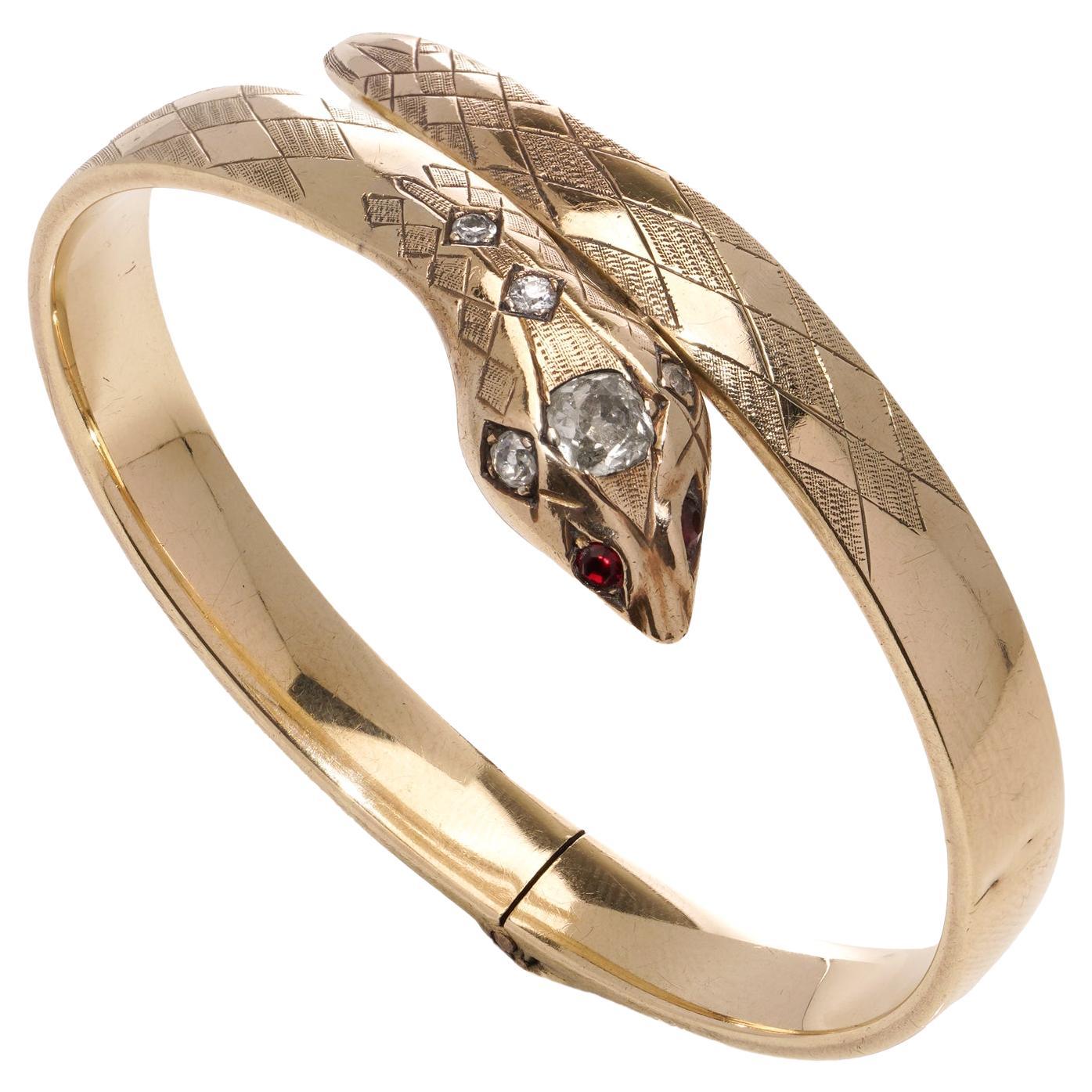 Vintage 9kt gold serpent bangle with diamonds and rubies  For Sale