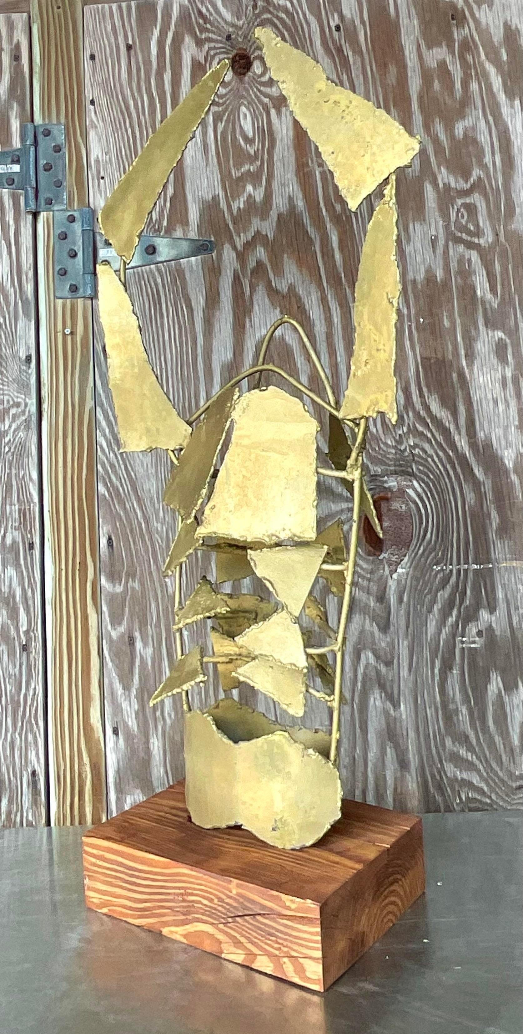 A striking vintage Coastal original steel sculpture. A monumental lobster in a torch cut metal. A brilliant gold finish on a gorgeous wood plinth. Acquired from a Palm Beach estate.