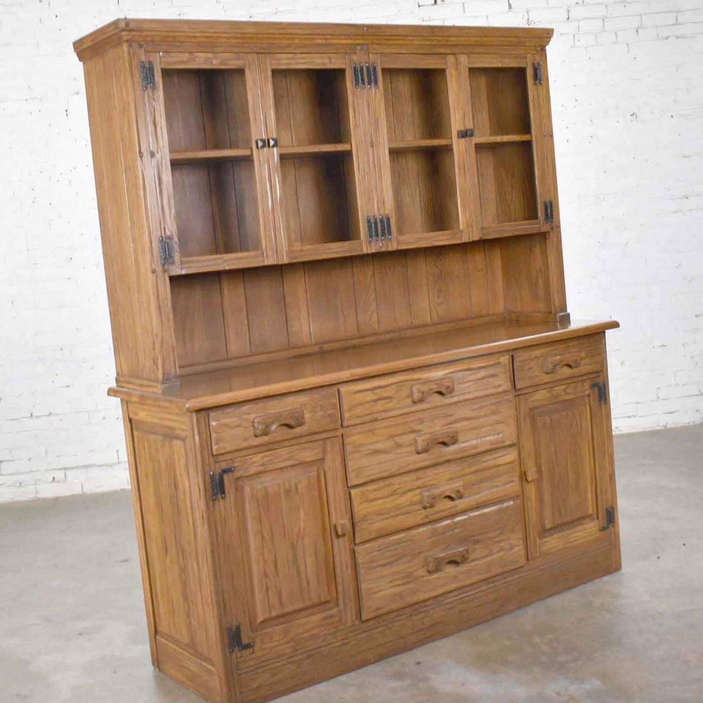 Handsome vintage western or rustic style Ranch Oak sideboard or china cabinet or hutch cabinet by A. Brandt. It is in wonderful vintage condition. We have not found any outstanding flaws only normal wear for age. Please see photos, circa mid-20th
