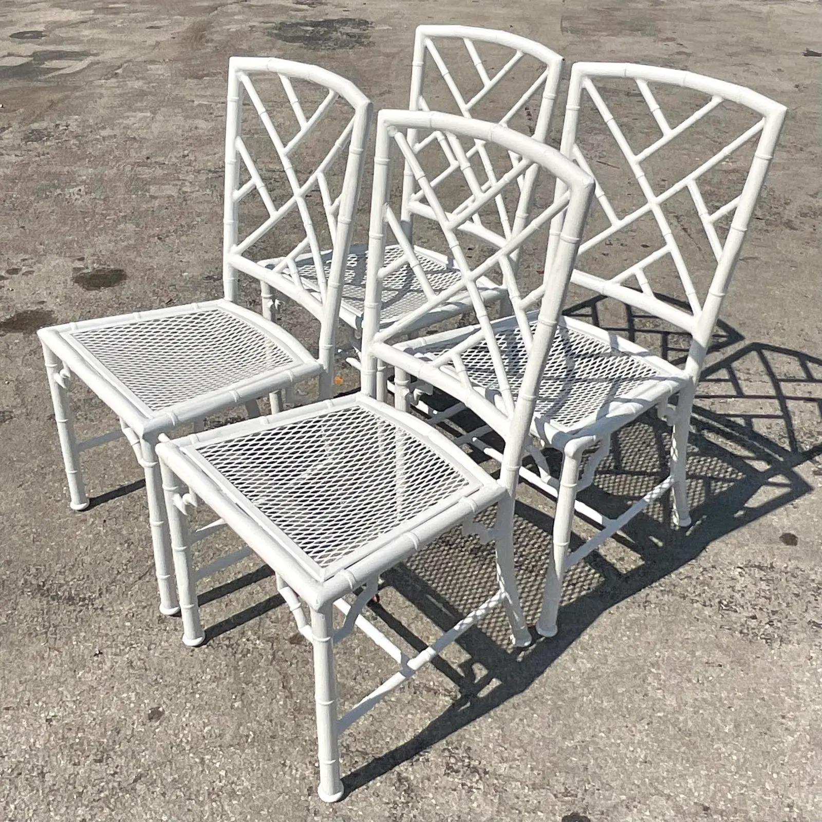 An exceptional vintage Coastal outdoor dining set. A set of four Chinese Chippendale chairs and matching pedestal. No glass. Done in a cast aluminum. Freshly powder coasted in a high gloss white. Acquired from a Palm Beach estate.

Pedestal