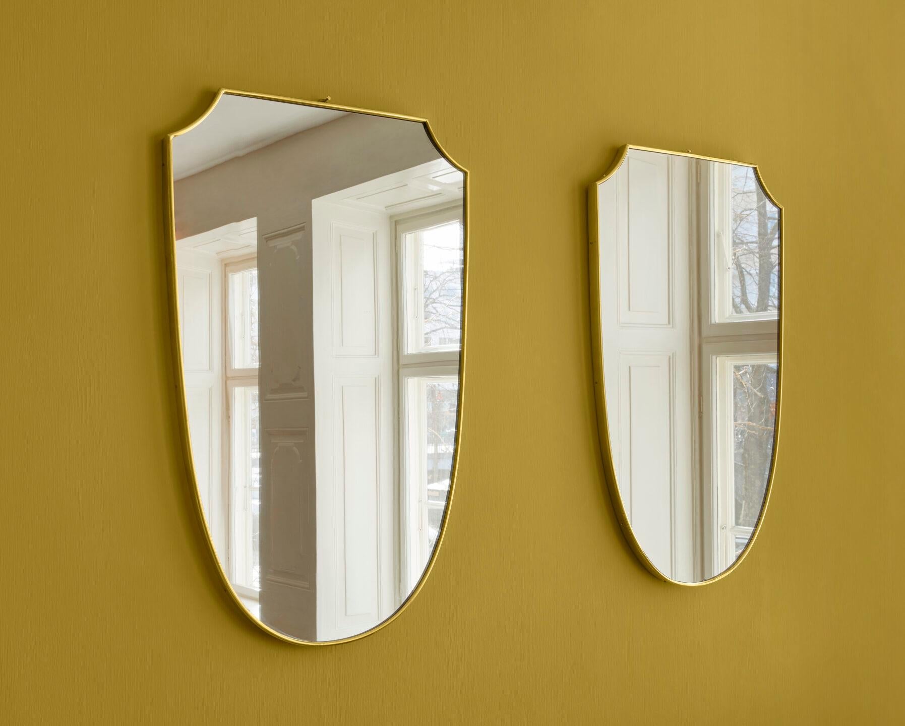 Italy, 1950s

A pair of brass mirrors.

Measures: H 75 x W 48 x D 2.5 cm.
