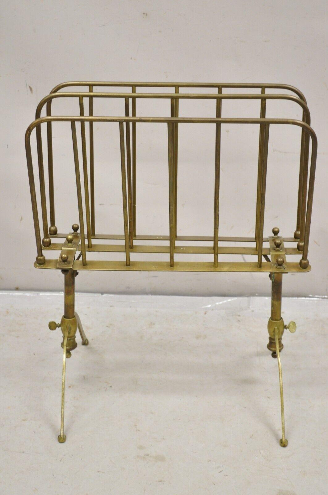 Vintage A. Ravenel Paris French Mid Century Modern Brass Magazine Holder Stand. Item features an adjustable height (23