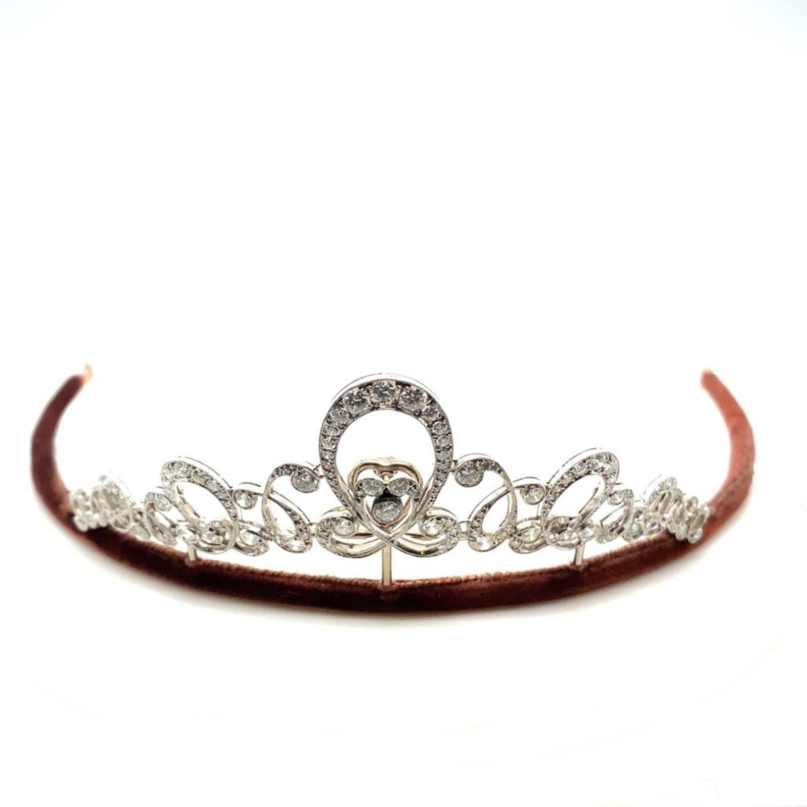 An A. Tillander diamond platinum tiara, circa 1910.

This exceptional diamond tiara by A. Tillander is beautifully handcrafted in platinum.

The tiara is composed of intertwining, scrolled sections grain and bezel set with transitional and eight cut