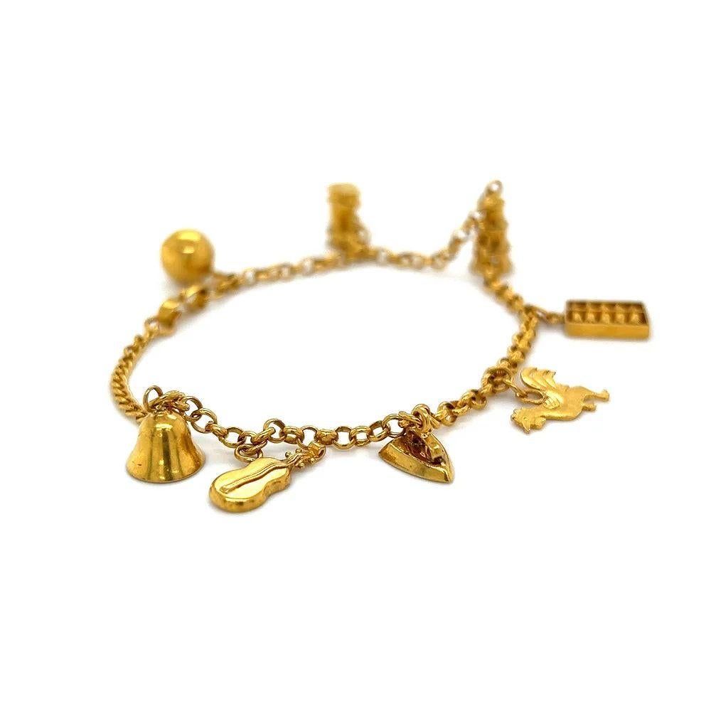 Modernist Vintage Abacus, Bell, Cello, Iron and Rooster Multi Charm Gold Bracelet For Sale