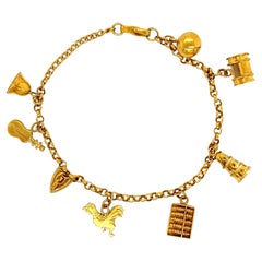 Retro Abacus, Bell, Cello, Iron and Rooster Multi Charm Gold Bracelet