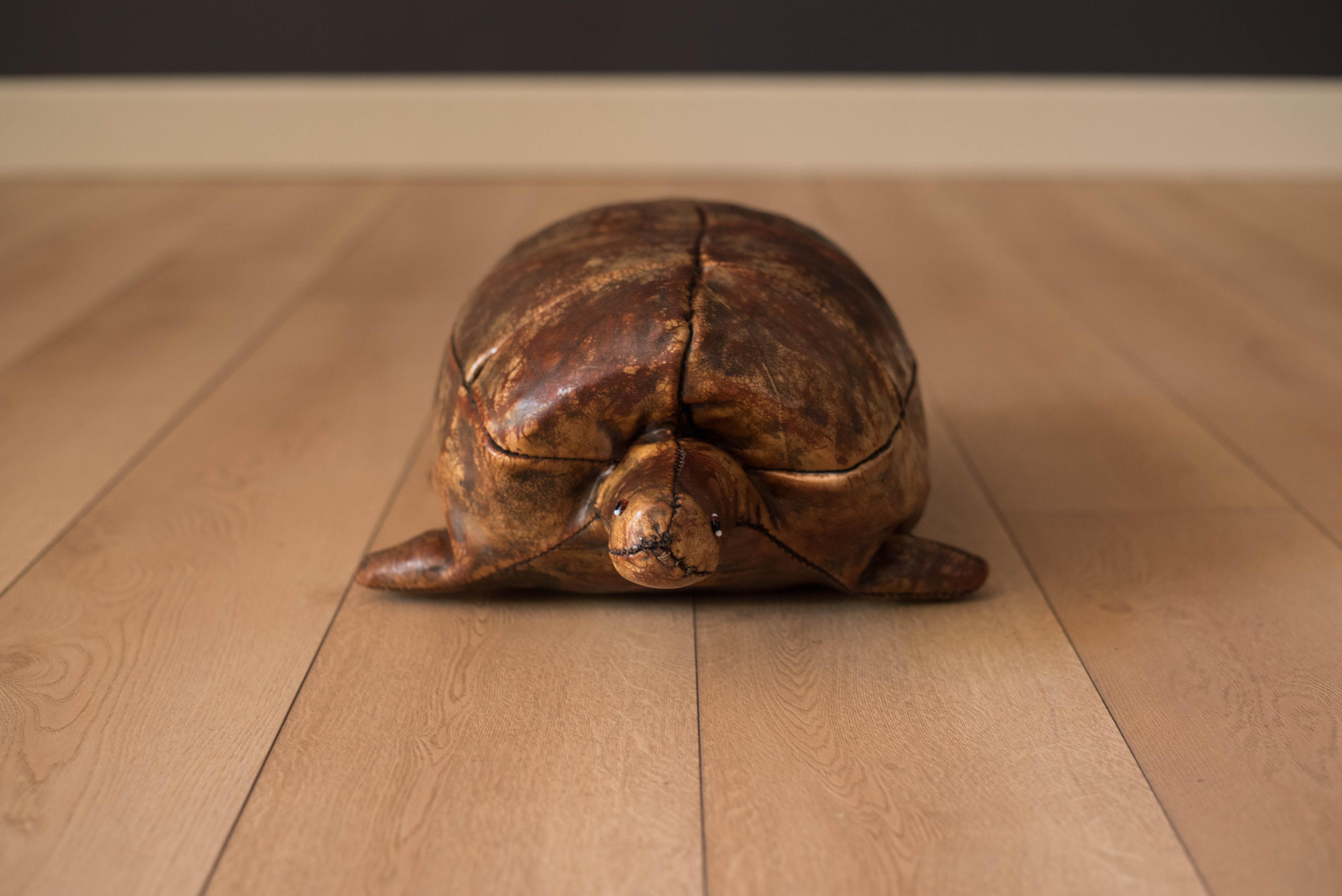 Mid-Century Modern original leather turtle designed by Dimitri Omersa for Abercrombie & Fitch, circa 1960s. This unique piece is handstitched with leather and glass eyes. Displays an aged leather patina and is branded 'Made in England'.


Offered by