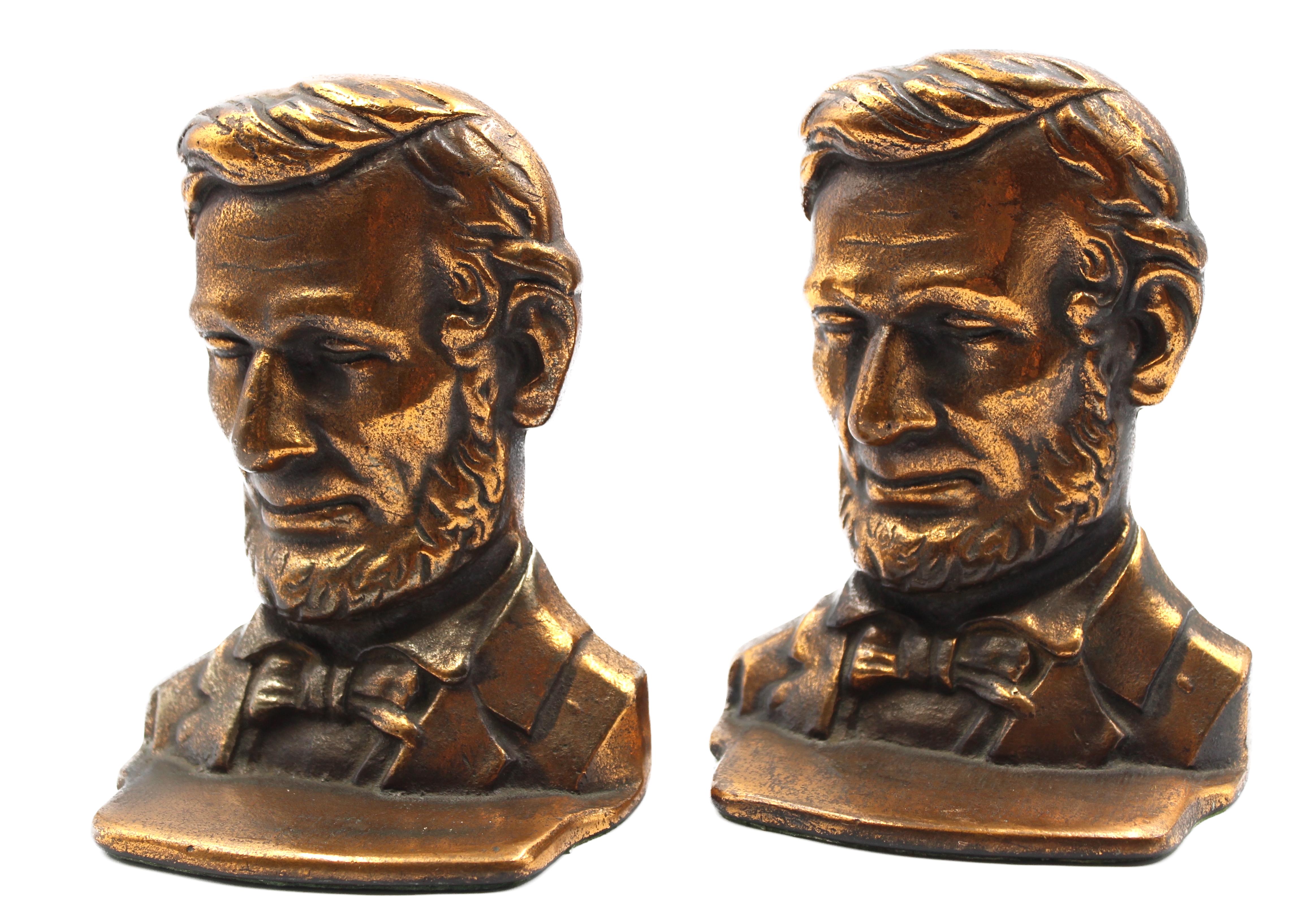 Offered is a pair of vintage Abraham Lincoln iron bust bookends. The pair feature the likeness of Abraham Lincoln with detailed facial features and formal attire. 

The Lincoln bust is modeled after the 1887 full-length standing bronze by Augustus
