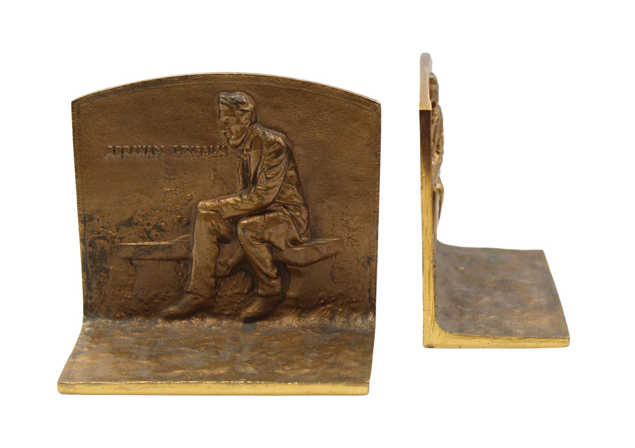 Presented is a pair of vintage bookends, featuring Abraham Lincoln seated on a bench. The scene is captured in raised relief on the front of the bookends, with the text “Abraham Lincoln” at upper left.
These bookends were modeled after the 1911