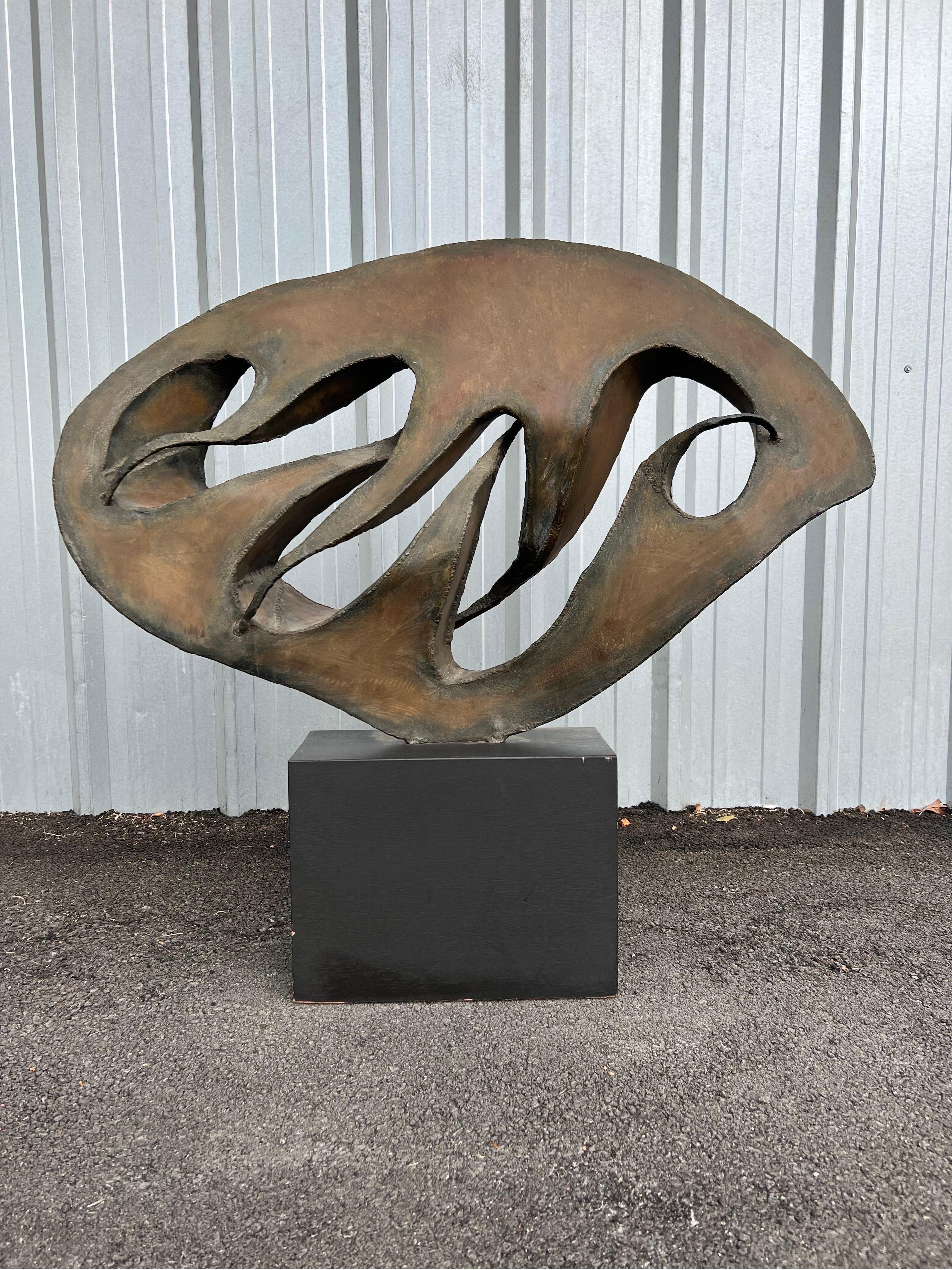 Vintage abstract brutalist sculpture made of steel with a bronze patinated finish that sits on a wood base. Unknown American artist and unsigned; this abstract brutalist sculpture sat in a public building located in Salt Lake City.