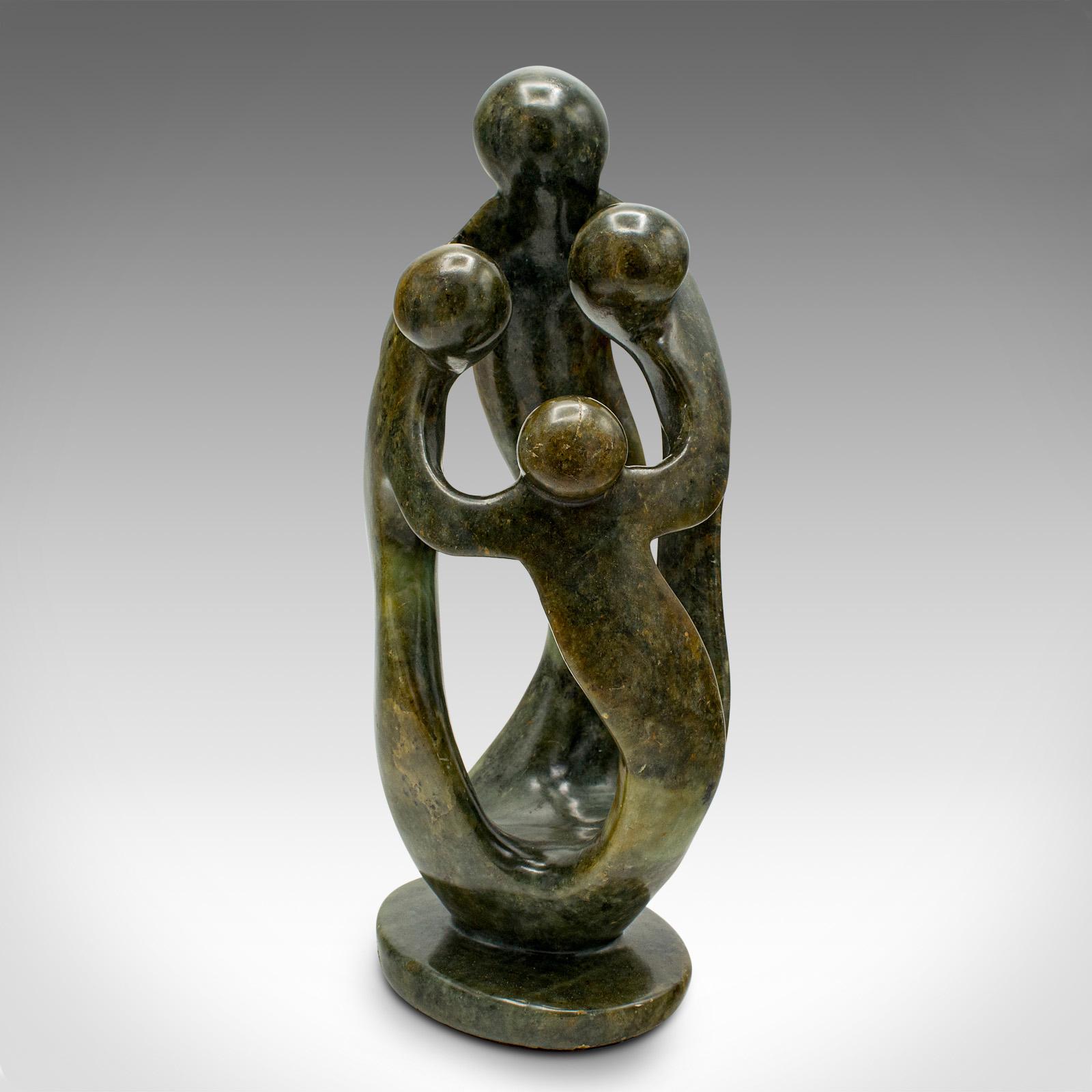 This is a vintage abstract family statue. A tribal African, polished hardstone decorative ornament, dating to the mid 20th century, circa 1960.

A parent and three children crafted from quality stone
Displaying a desirable aged patina and in good