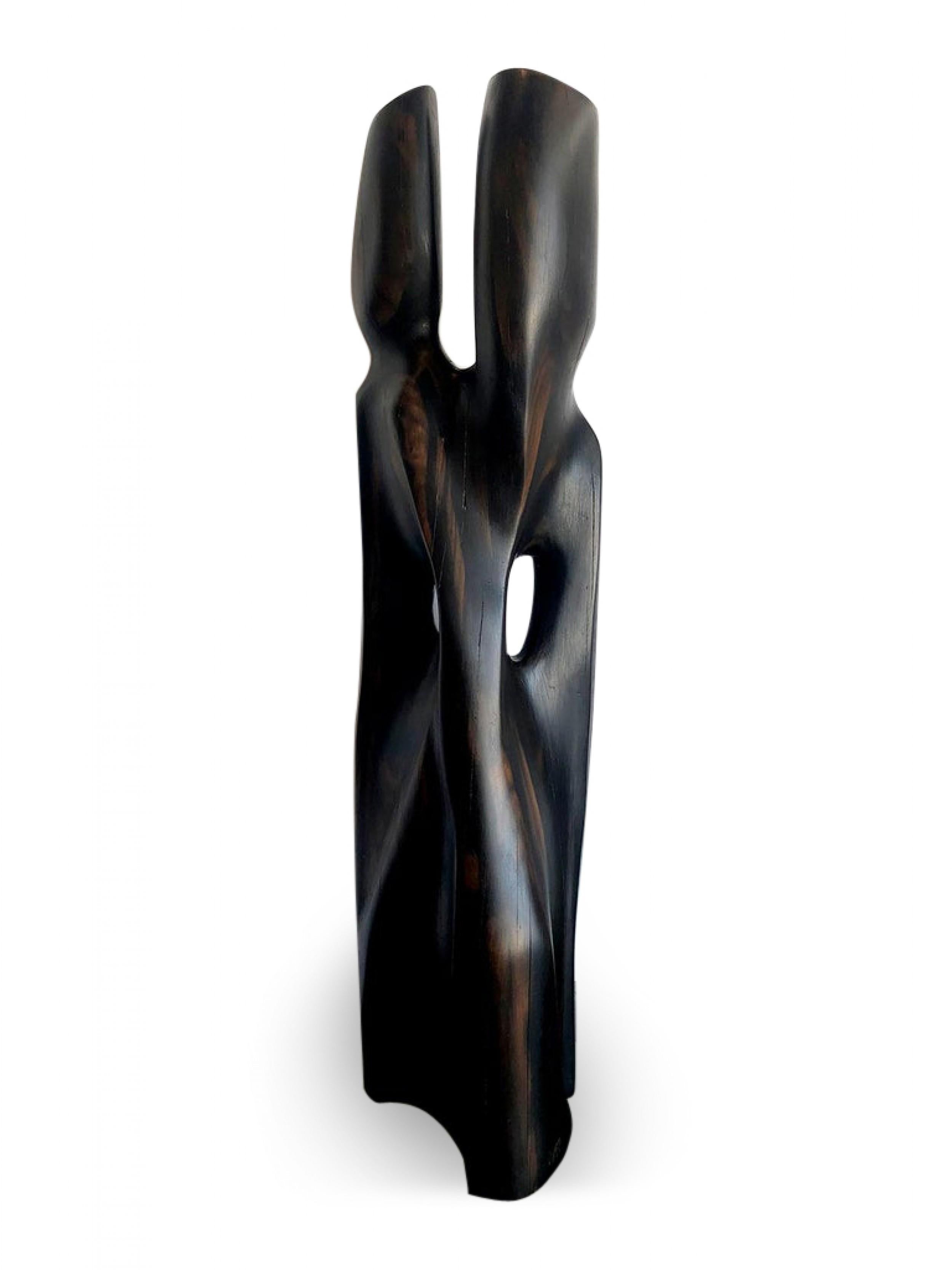 Vintage abstract sculpture of two combined figures.