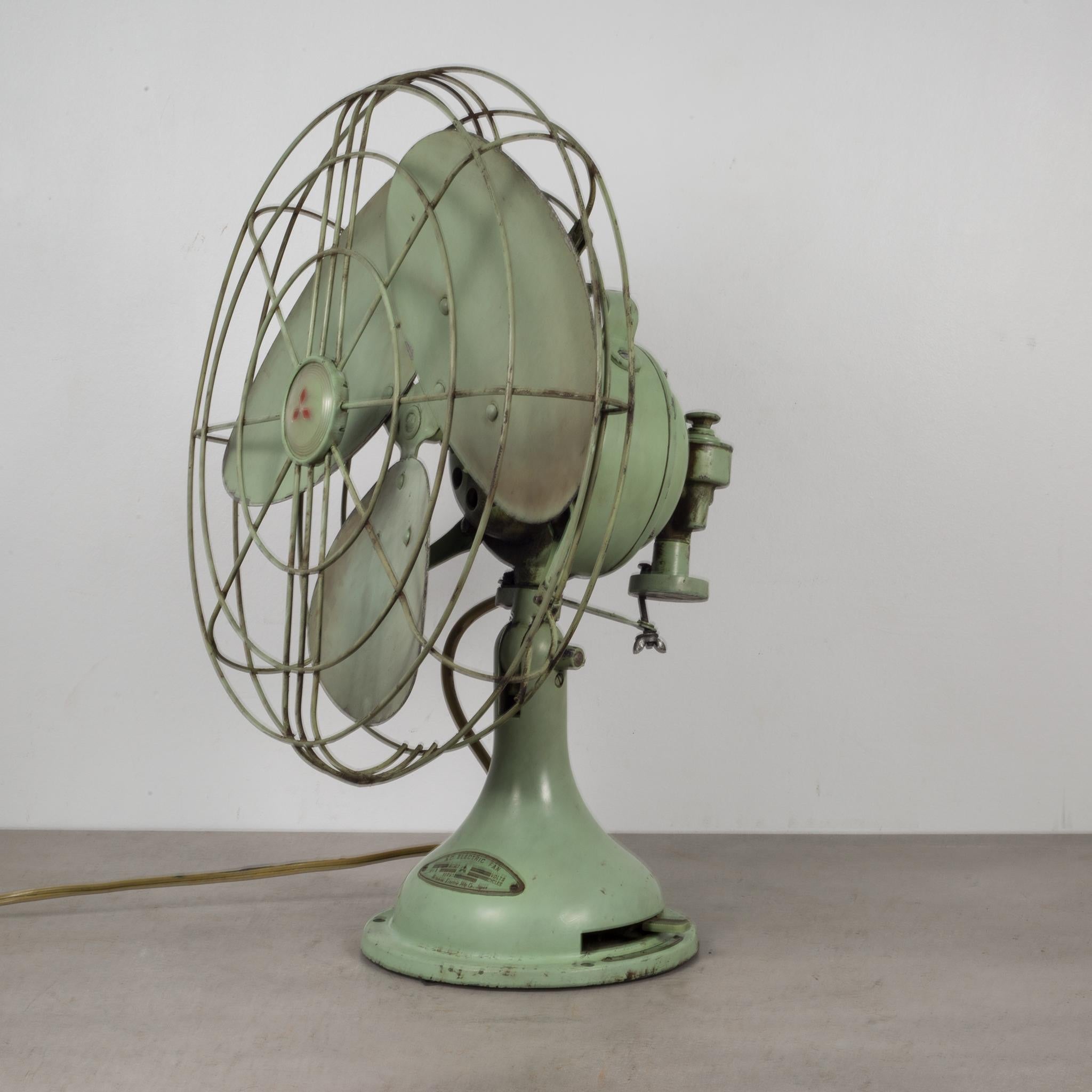 About

A steel and metal oscillating fan with tilting head, three power settings, original green paint, original label and built in handle. The wiring is good and the fan is in working condition with quiet but powerful settings.

 Creator: A.C.