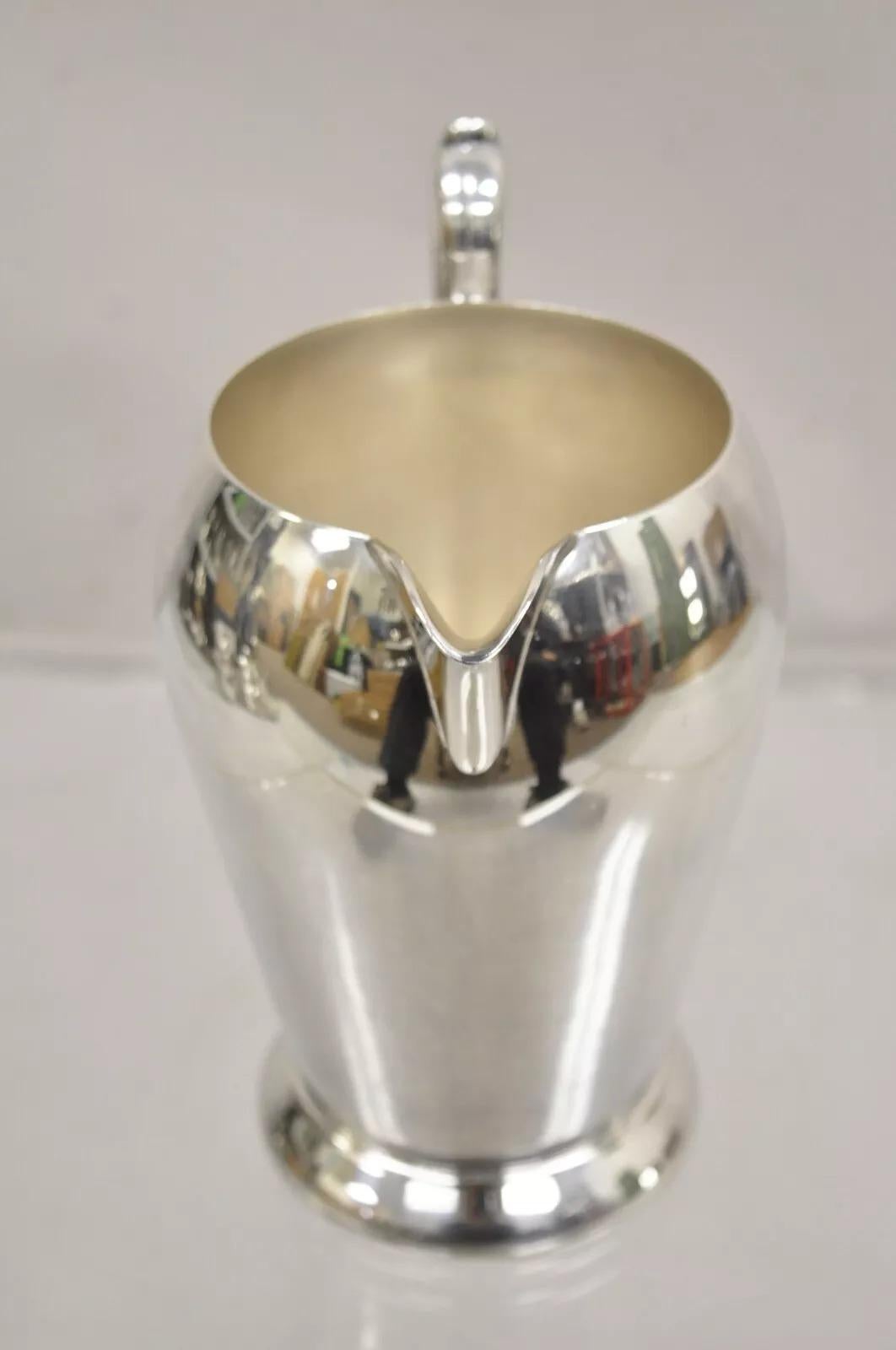 Vintage Academy Art Deco Silver Plated Copper Water Pitcher. Circa Mid 20th Century. Measurements: 9