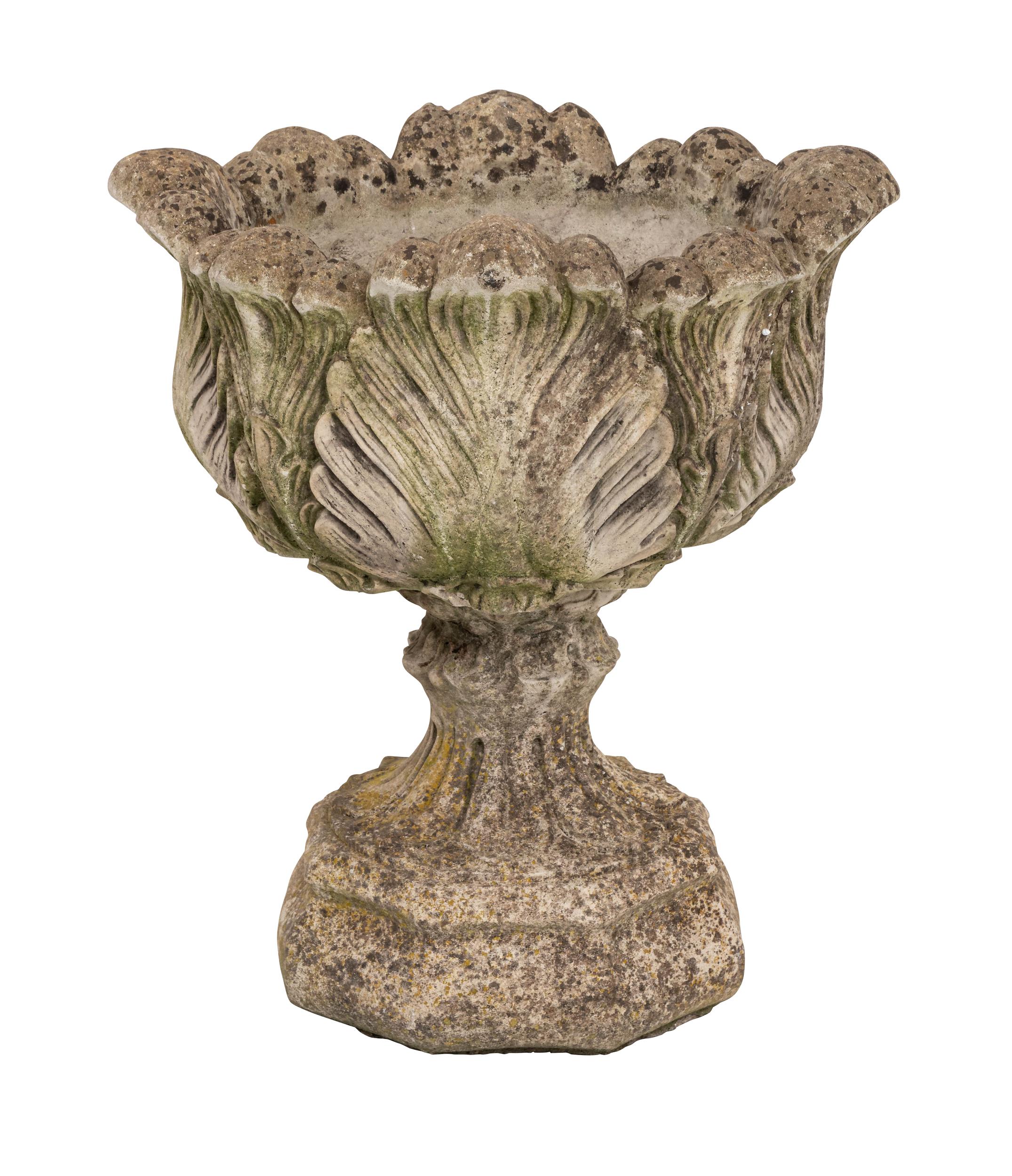 Classic pair of cast stone acanthus leaf planters on stands from France made in the 20th century. Intricate foliage makes up the beautiful design. This sturdy architectural pot is ideal for elevating greenery for a striking landscape. Beautifully