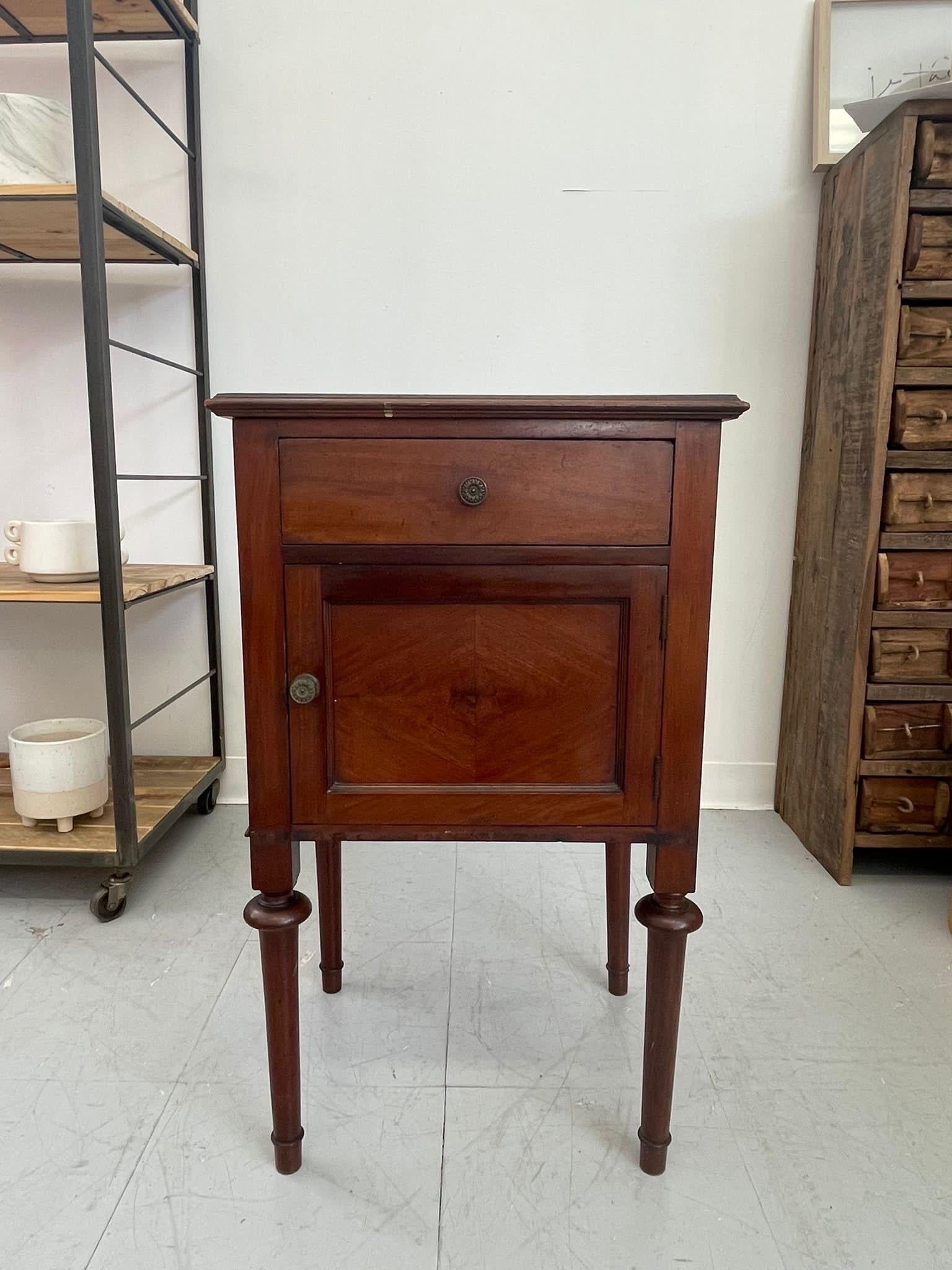 Antique Style Table with Single Drawer and Cabinet. The Wood has Nice Patins and Character. Unique Hardware and Legs as and Pictured. Vintage wear Consistent with Age.

Dimensions. 15 W ; 13 D ; 29 1/2 H