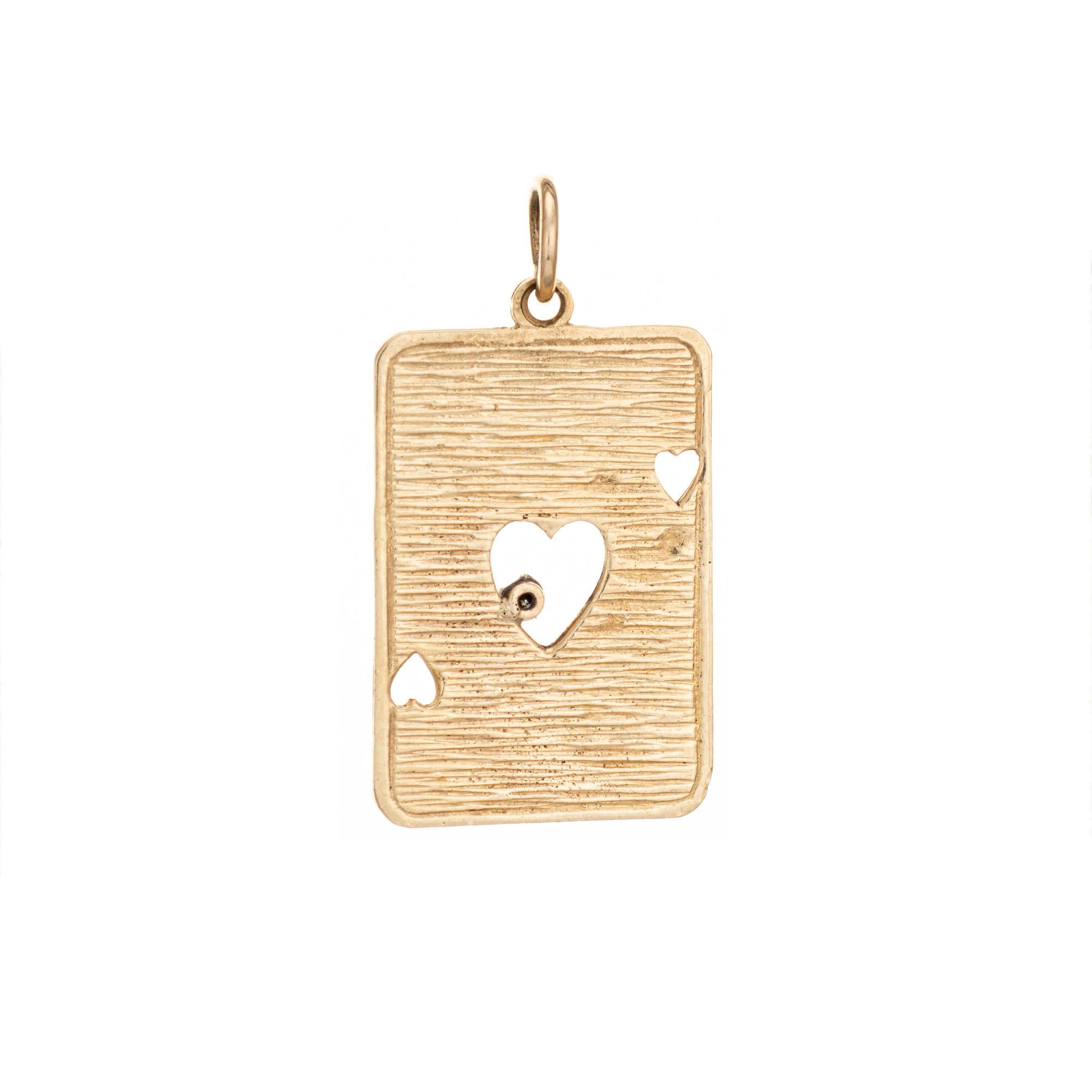 Finely detailed vintage Ace card charm crafted in 14k yellow gold (circa 1960s).  

One estimated 0.01 carat diamond is set into the charm 9estimated at H-I color and I1 clarity).

The Ace of cards is set with a diamond for good luck and three cut