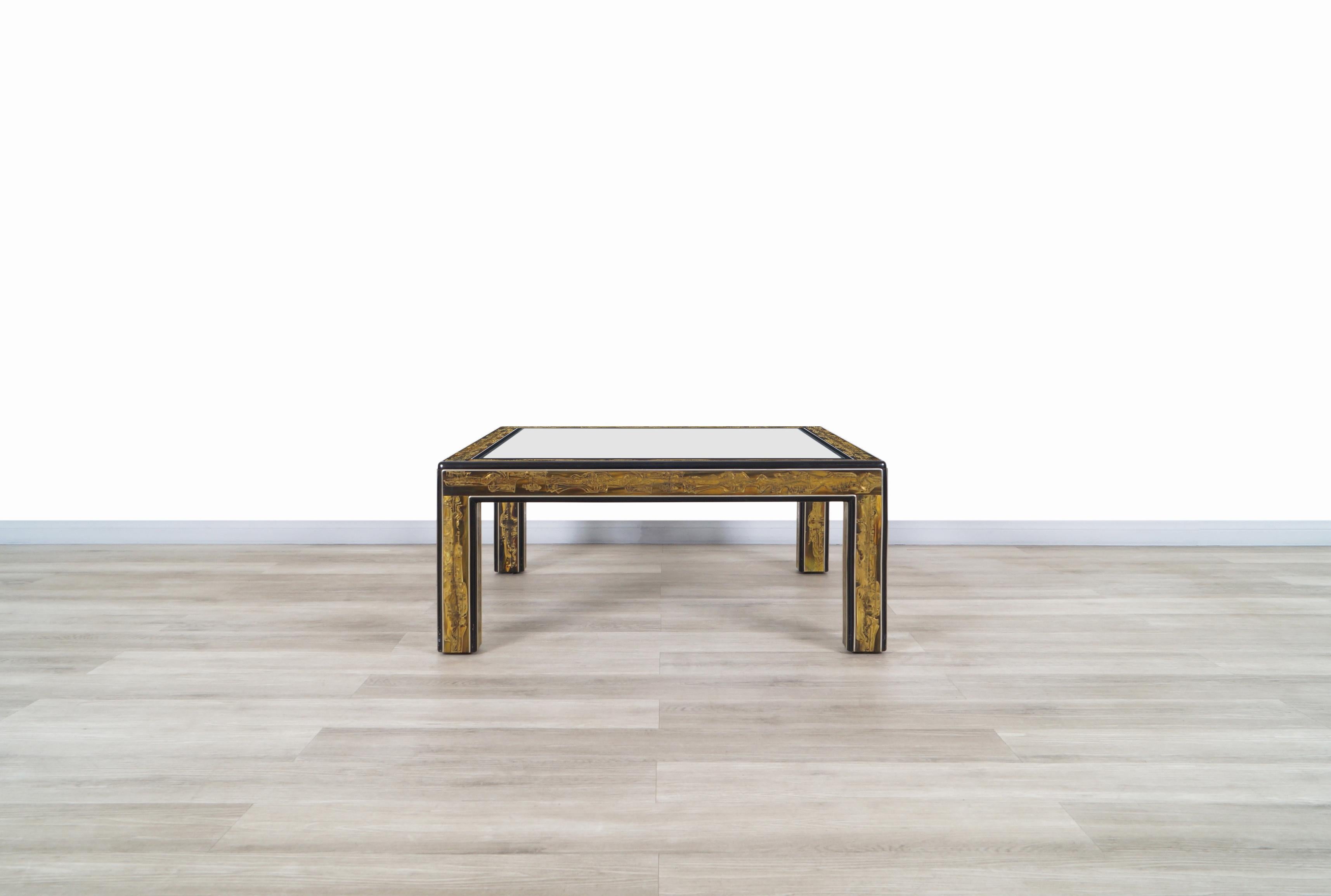 Wonderful vintage acid etched brass coffee table designed by Bernhard Rohne for Mastercraft in United States, circa 1970s. This coffee table presents a unique aesthetic throughout its structure. Features acid etched brass strips that show detailed
