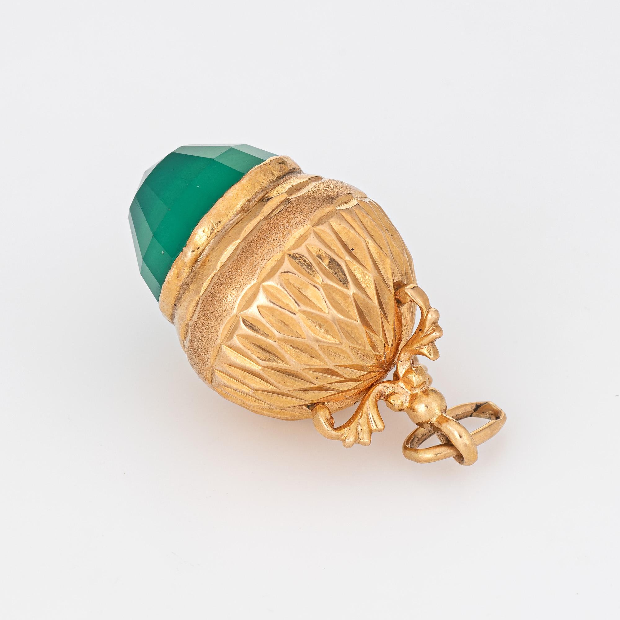 Finely detailed vintage acorn charm crafted in 14k yellow gold (circa 1960s).  

Faceted chrysoprase measures 12mm (in very good condition and free of cracks or chips).

The acorn is rendered in lifelike detail with the faceted chrysoprase offering