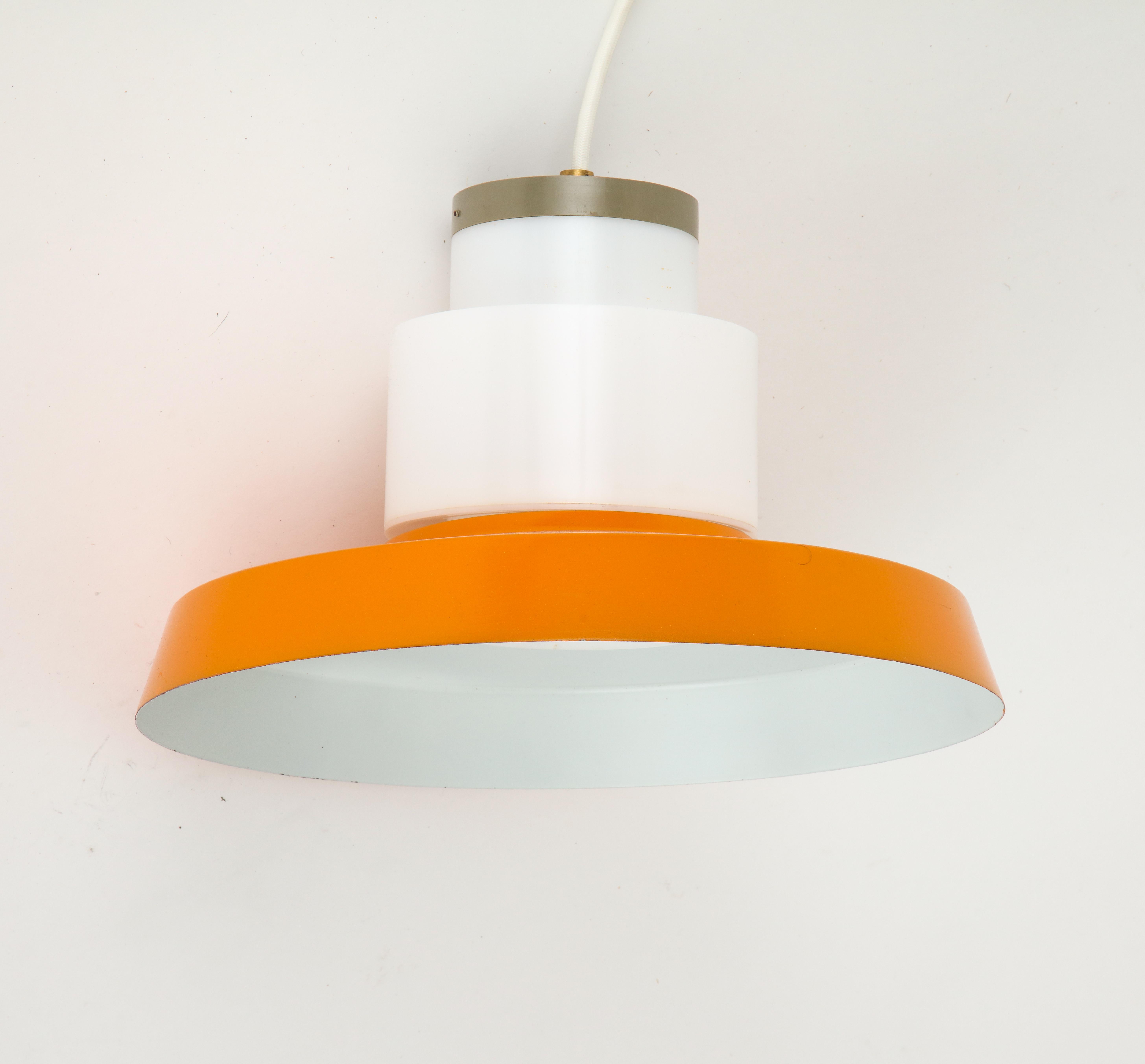 Danish orange and white pendant from the 1960s.

Wired to US standards.
